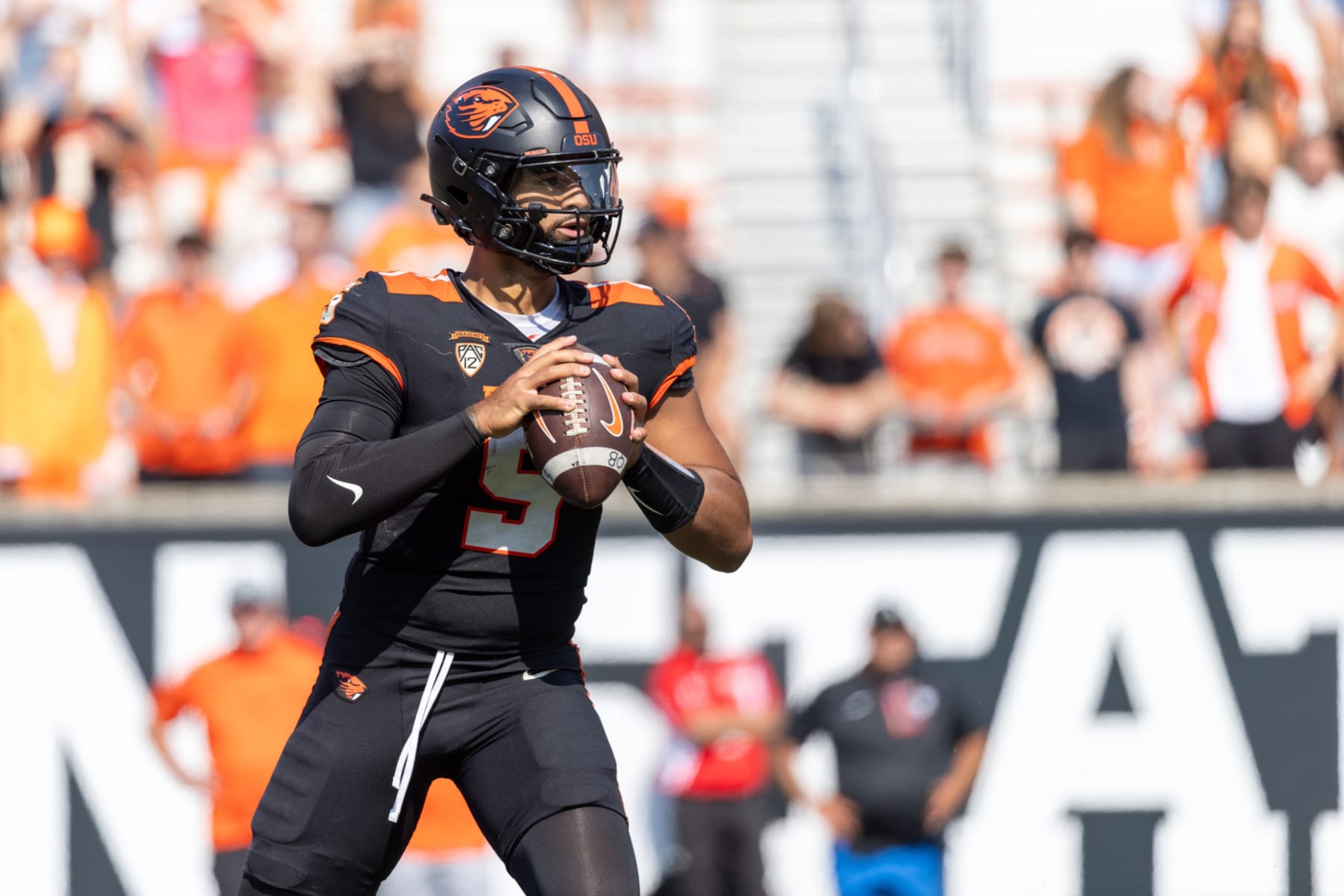 CORVALLIS, OREGON - SEPTEMBER 16: Quarterback DJ Uiagalelei #5 of the Oregon State Beavers rolls out to pass against the San Diego State Aztecs during the second half at Reser Stadium on September 16, 2023 in Corvallis, Oregon. (Photo by Tom Hauck/Getty Images)