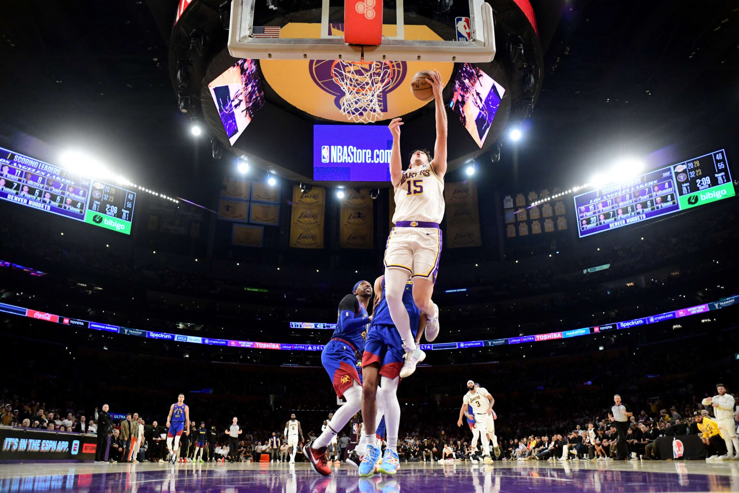 LOS ANGELES, CA - MAY 20: Austin Reaves #15 of the Los Angeles Lakers drives to the basket against the Denver Nuggets during Game Three of the Western Conference Finals on May 20, 2023 at Crypto.Com Arena in Los Angeles, California. NOTE TO USER: User expressly acknowledges and agrees that, by downloading and/or using this Photograph, user is consenting to the terms and conditions of the Getty Images License Agreement. Mandatory Copyright Notice: Copyright 2023 NBAE (Photo by Adam Pantozzi/NBAE via Getty Images)