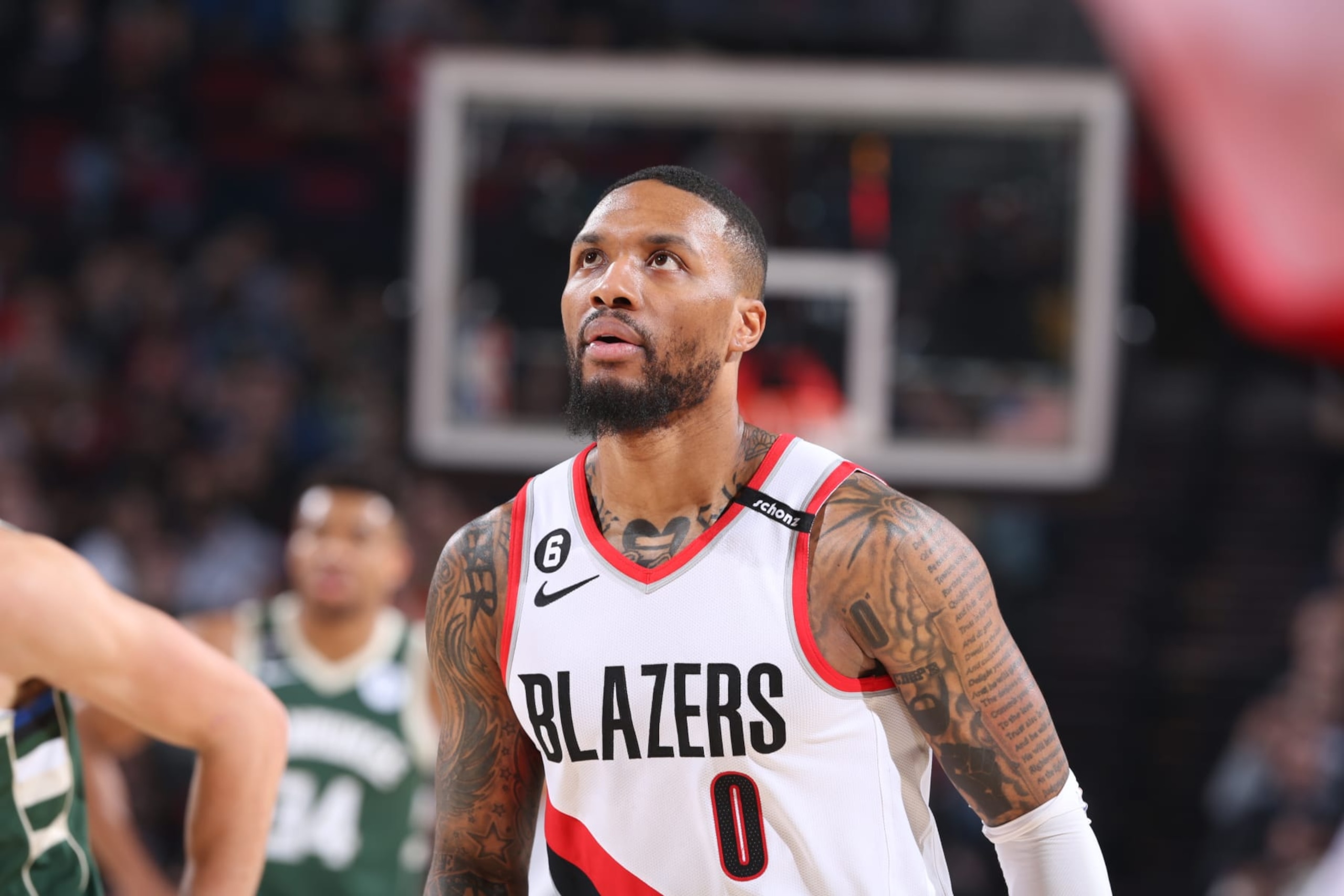 PORTLAND, OR - FEBRUARY 6: Damian Lillard #0 of the Portland Trail Blazers looks on during the game against the Milwaukee Bucks on February 6, 2023 at the Moda Center Arena in Portland, Oregon. NOTE TO USER: User expressly acknowledges and agrees that, by downloading and or using this photograph, user is consenting to the terms and conditions of the Getty Images License Agreement. Mandatory Copyright Notice: Copyright 2022 NBAE (Photo by Sam Forencich/NBAE via Getty Images) PORTLAND, OR - FEBRUARY 6: Damian Lillard #0 of the Portland Trail Blazers looks on during the game against the Milwaukee Bucks on February 6, 2023 at the Moda Center Arena in Portland, Oregon. NOTE TO USER: User expressly acknowledges and agrees that, by downloading and or using this photograph, user is consenting to the terms and conditions of the Getty Images License Agreement. Mandatory Copyright Notice: Copyright 2022 NBAE (Photo by Sam Forencich/NBAE via Getty Images)