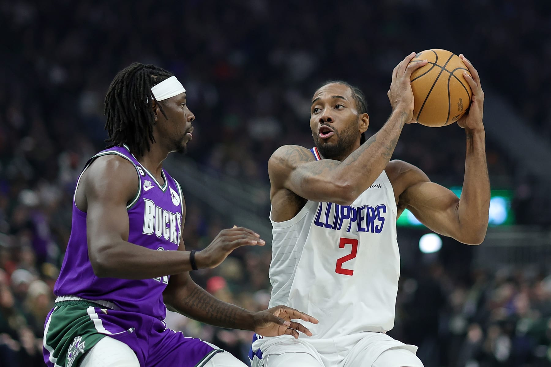MILWAUKEE, WISCONSIN - FEBRUARY 02: Kawhi Leonard #2 of the LA Clippers is defended by Jrue Holiday #21 of the Milwaukee Bucks during a game at Fiserv Forum on February 02, 2023 in Milwaukee, Wisconsin.  The Bucks defeated the Clippers 106-105. NOTE TO USER: User expressly acknowledges and agrees that, by downloading and or using this photograph, User is consenting to the terms and conditions of the Getty Images License Agreement. (Photo by Stacy Revere/Getty Images)