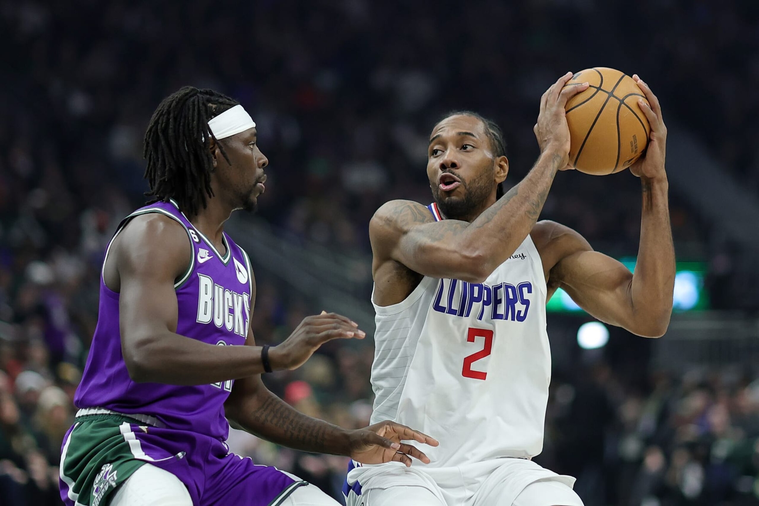 MILWAUKEE, WISCONSIN - FEBRUARY 02: Kawhi Leonard #2 of the LA Clippers is defended by Jrue Holiday #21 of the Milwaukee Bucks during a game at Fiserv Forum on February 02, 2023 in Milwaukee, Wisconsin.  The Bucks defeated the Clippers 106-105. NOTE TO USER: User expressly acknowledges and agrees that, by downloading and or using this photograph, User is consenting to the terms and conditions of the Getty Images License Agreement. (Photo by Stacy Revere/Getty Images)