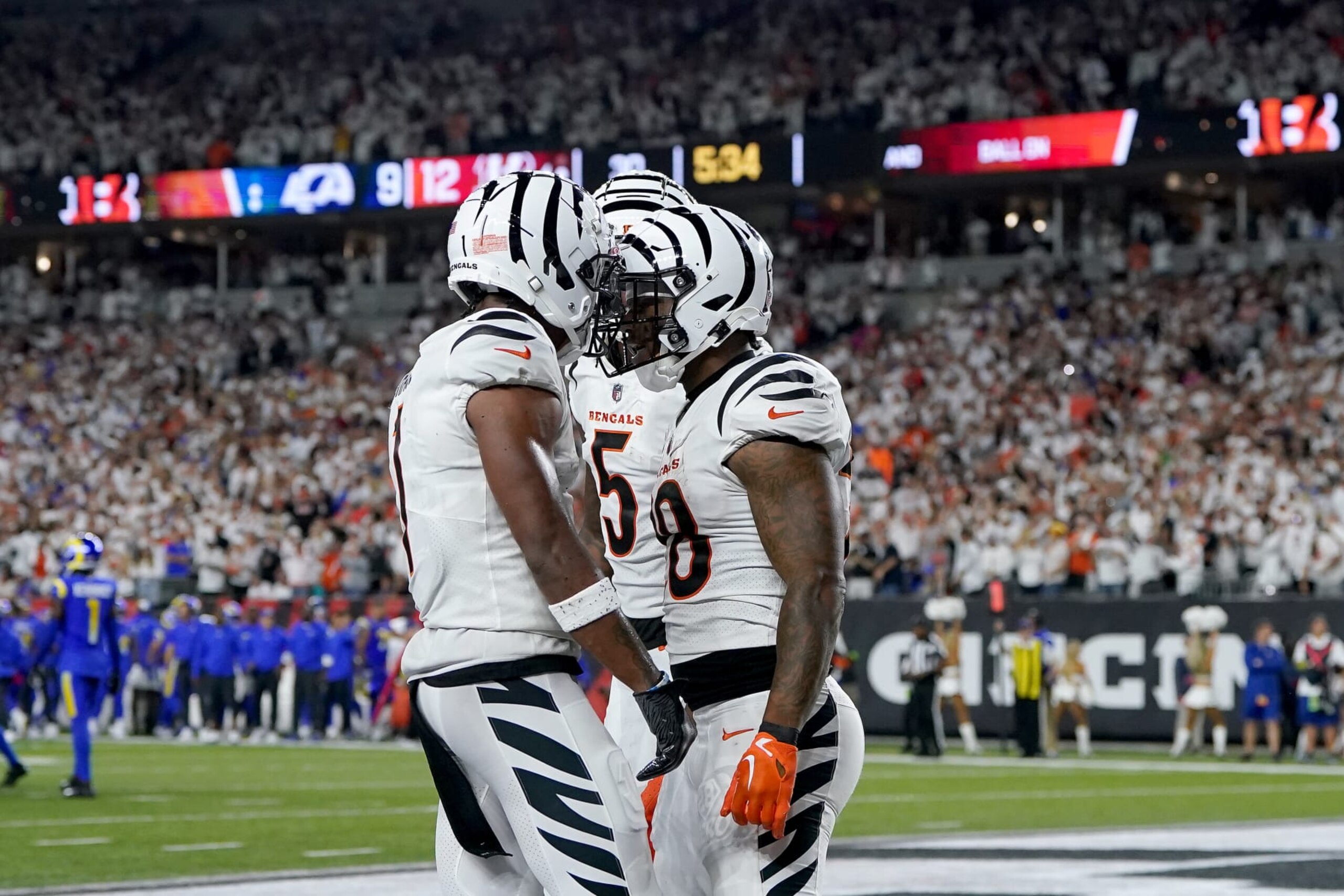 CINCINNATI, OHIO - SEPTEMBER 25: Joe Mixon #28 of the Cincinnati Bengals celebrates with Ja'Marr Chase #1 and Tee Higgins #5 after scoring a touchdown against the Los Angeles Rams during the third quarter in the game at Paycor Stadium on September 25, 2023 in Cincinnati, Ohio. (Photo by Dylan Buell/Getty Images)
