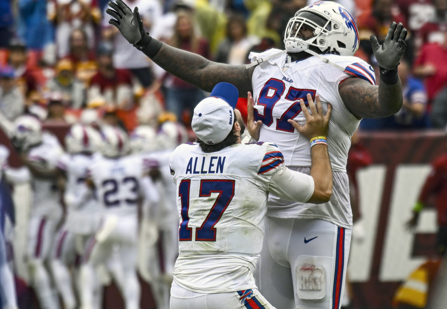 LANDOVER, MD - SEPTEMBER 24: Buffalo Bills quarterback Josh Allen (17) tries to lift defensive tackle Jordan Phillips (97) after his touchdown  run during the NFL game between the Buffalo Bills and the Washington Commanders on September 24, 2023 at Fed Ex Field in Landover, MD.  (Photo by Mark Goldman/Icon Sportswire via Getty Images)