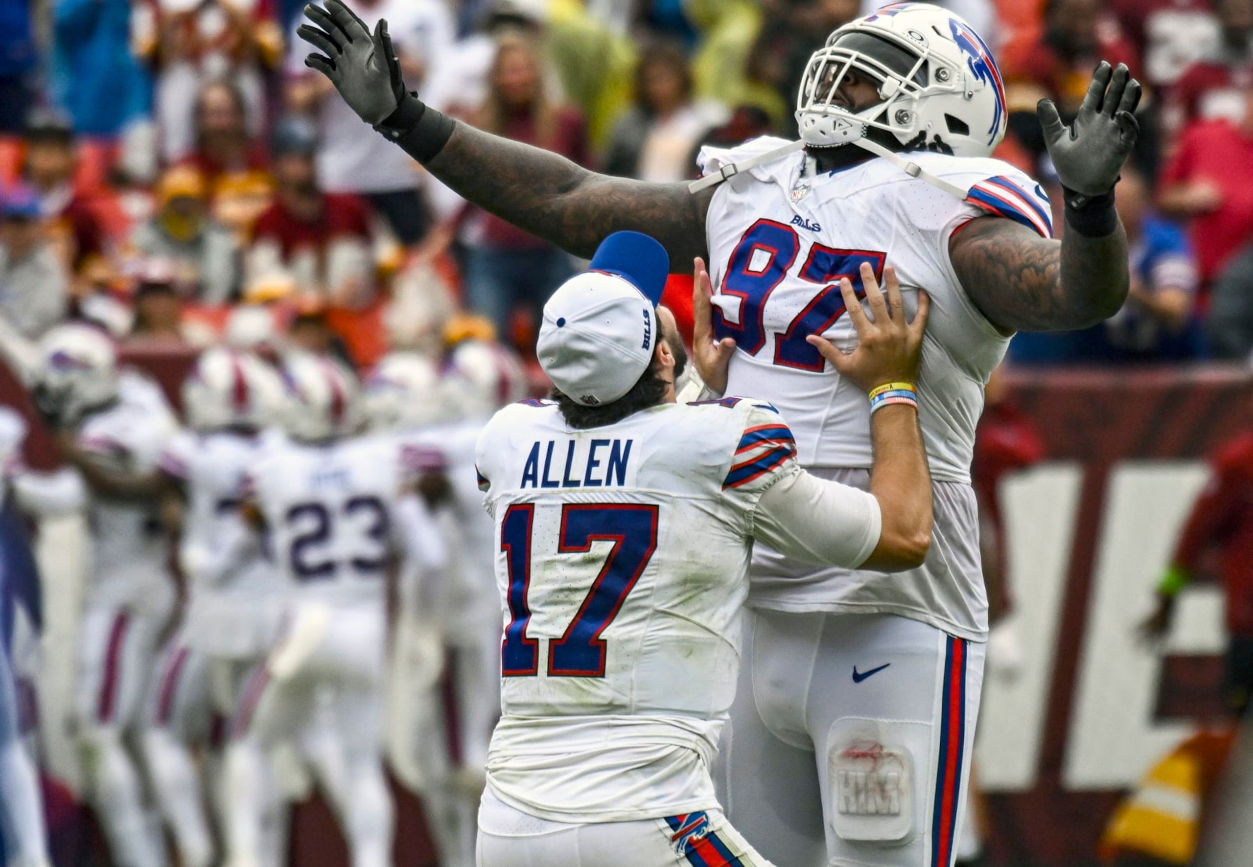 LANDOVER, MD - SEPTEMBER 24: Buffalo Bills quarterback Josh Allen (17) tries to lift defensive tackle Jordan Phillips (97) after his touchdown  run during the NFL game between the Buffalo Bills and the Washington Commanders on September 24, 2023 at Fed Ex Field in Landover, MD.  (Photo by Mark Goldman/Icon Sportswire via Getty Images)