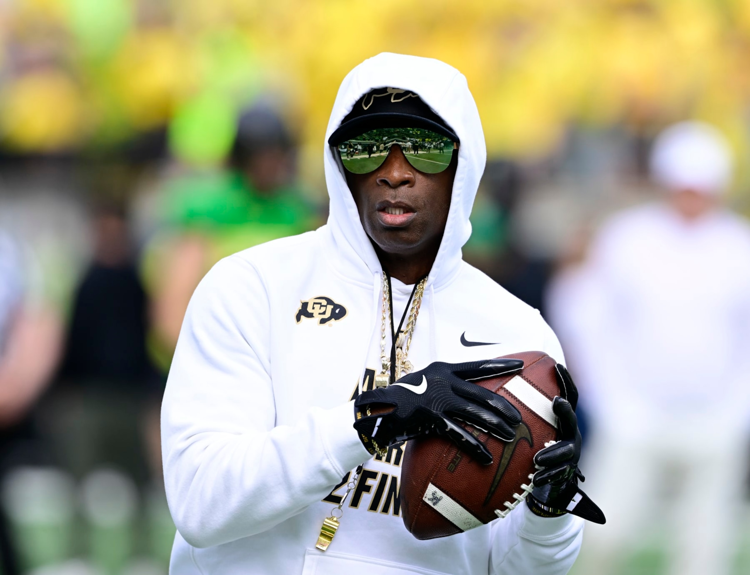 EUGENE, OR - SEPTEMBER 23: Colorado Buffaloes head coach Deion Sanders plays a little catch on the field just before warmups before playing the Oregon Ducks at Autzen Stadium September 23, 2023. (Photo by Andy Cross/MediaNews Group/The Denver Post via Getty Images)