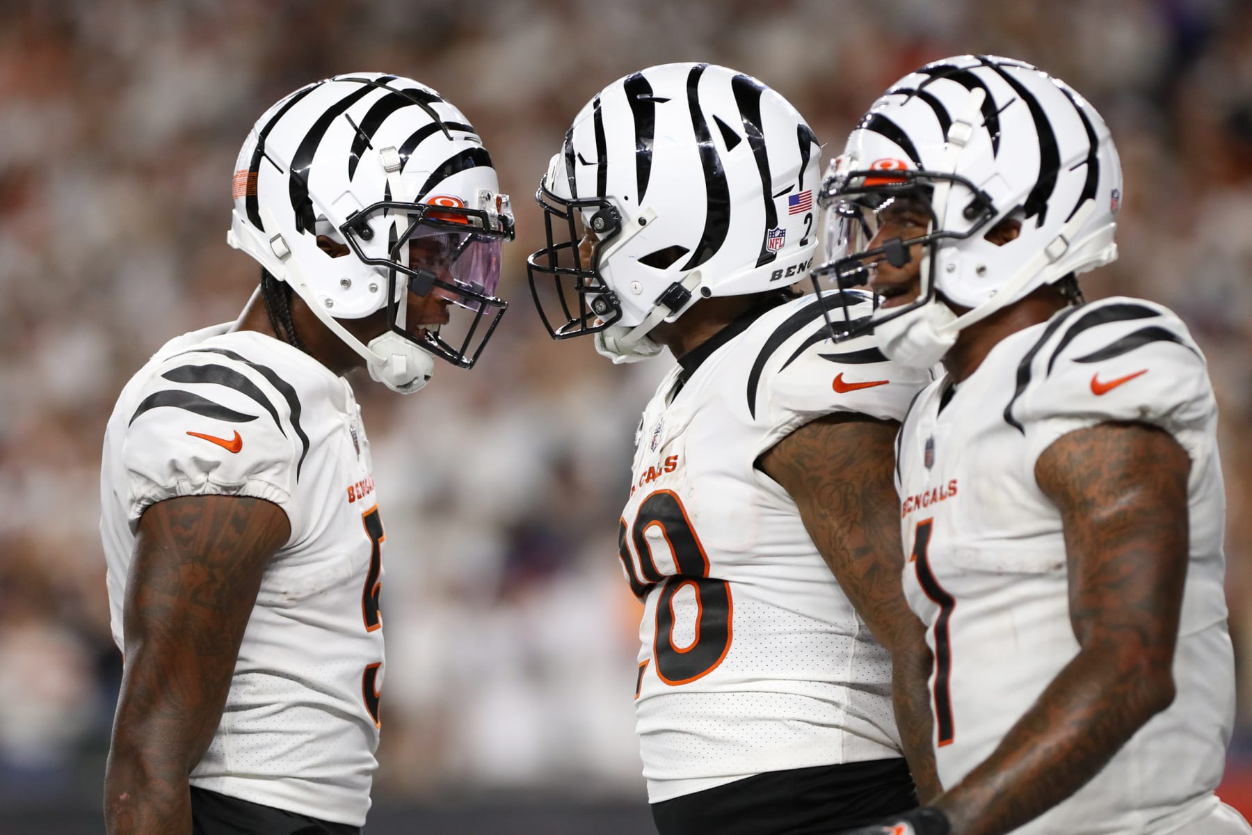 CINCINNATI, OH - SEPTEMBER 25: Cincinnati Bengals wide receiver Tee Higgins (5) reacts with running back Joe Mixon (28) and wide receiver Ja'Marr Chase (1), after Mixon scored a touchdown. During the game against the Los Angeles Rams and the Cincinnati Bengals on September 25, 2023, at Paycor Stadium in Cincinnati, OH. (Photo by Ian Johnson/Icon Sportswire via Getty Images