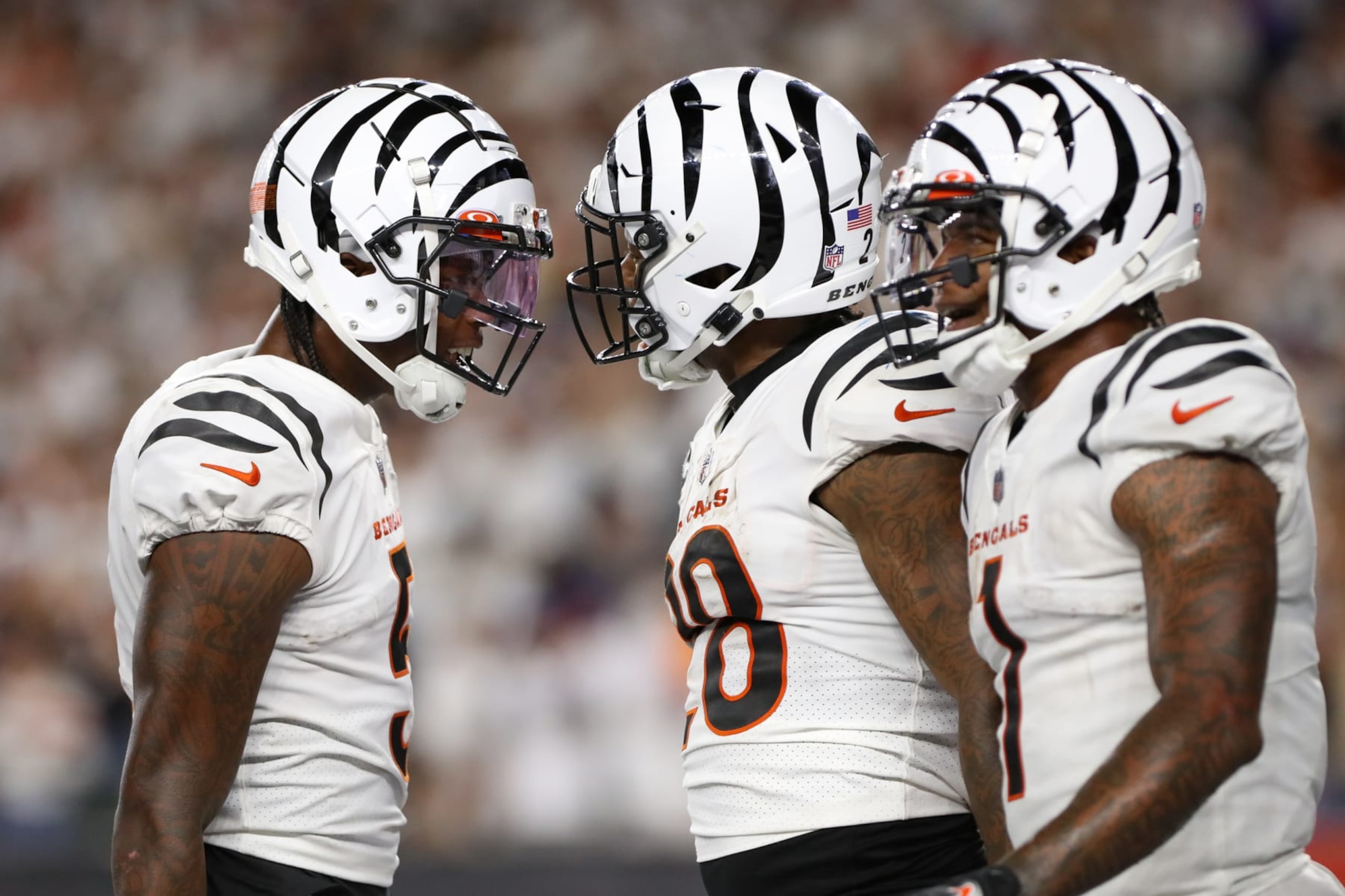 CINCINNATI, OH - SEPTEMBER 25: Cincinnati Bengals wide receiver Tee Higgins (5) reacts with running back Joe Mixon (28) and wide receiver Ja'Marr Chase (1), after Mixon scored a touchdown. During the game against the Los Angeles Rams and the Cincinnati Bengals on September 25, 2023, at Paycor Stadium in Cincinnati, OH. (Photo by Ian Johnson/Icon Sportswire via Getty Images