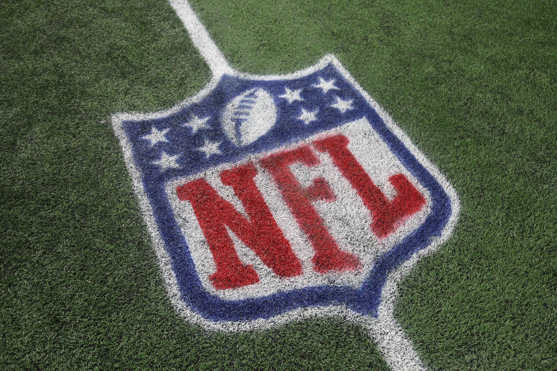 FOXBOROUGH, MASSACHUSETTS - SEPTEMBER 17: A detail of the NFL shield logo on the field during the game between the Miami Dolphins and the New England Patriots at Gillette Stadium on September 17, 2023 in Foxborough, Massachusetts. (Photo by Adam Glanzman/Getty Images)