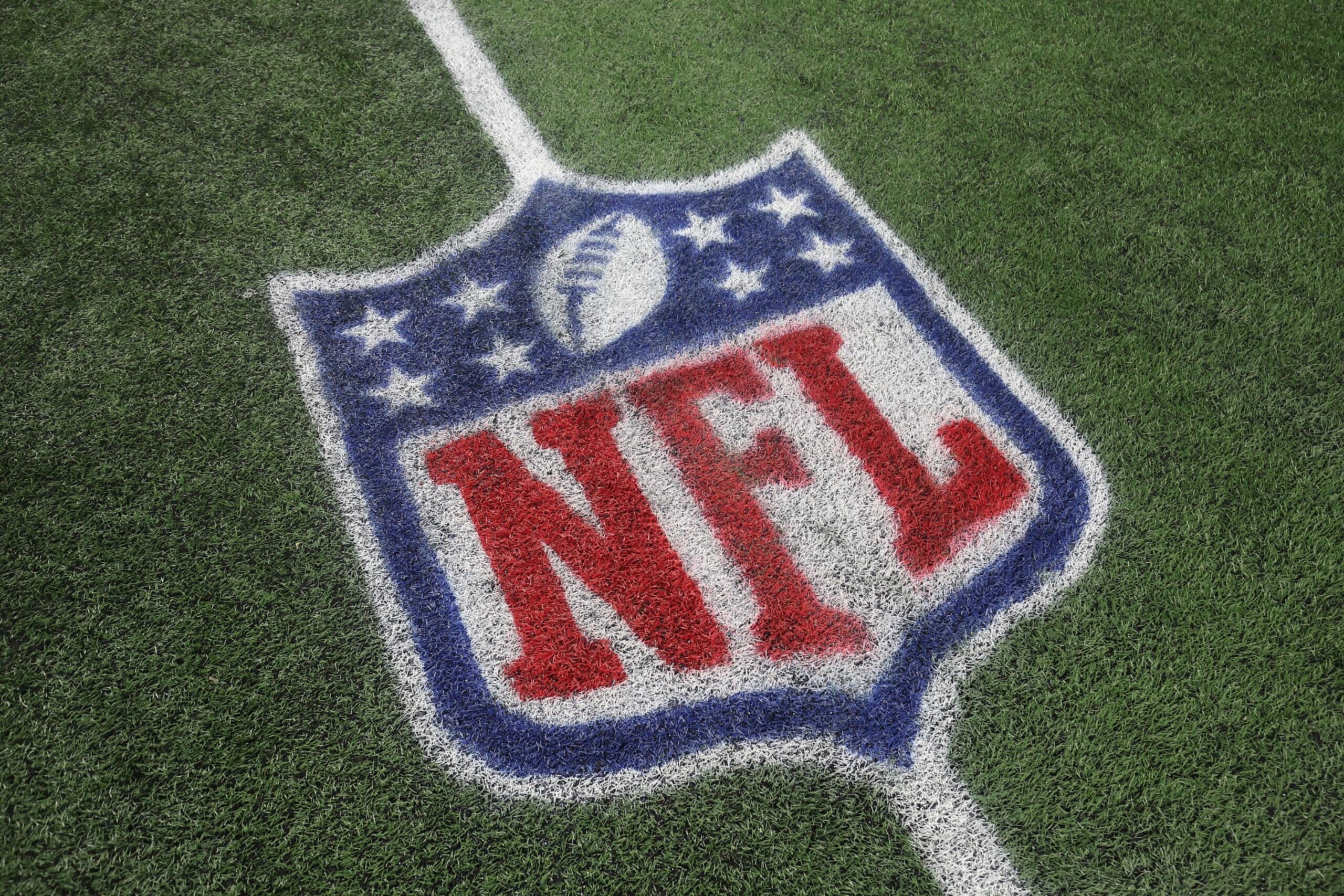 FOXBOROUGH, MASSACHUSETTS - SEPTEMBER 17: A detail of the NFL shield logo on the field during the game between the Miami Dolphins and the New England Patriots at Gillette Stadium on September 17, 2023 in Foxborough, Massachusetts. (Photo by Adam Glanzman/Getty Images)