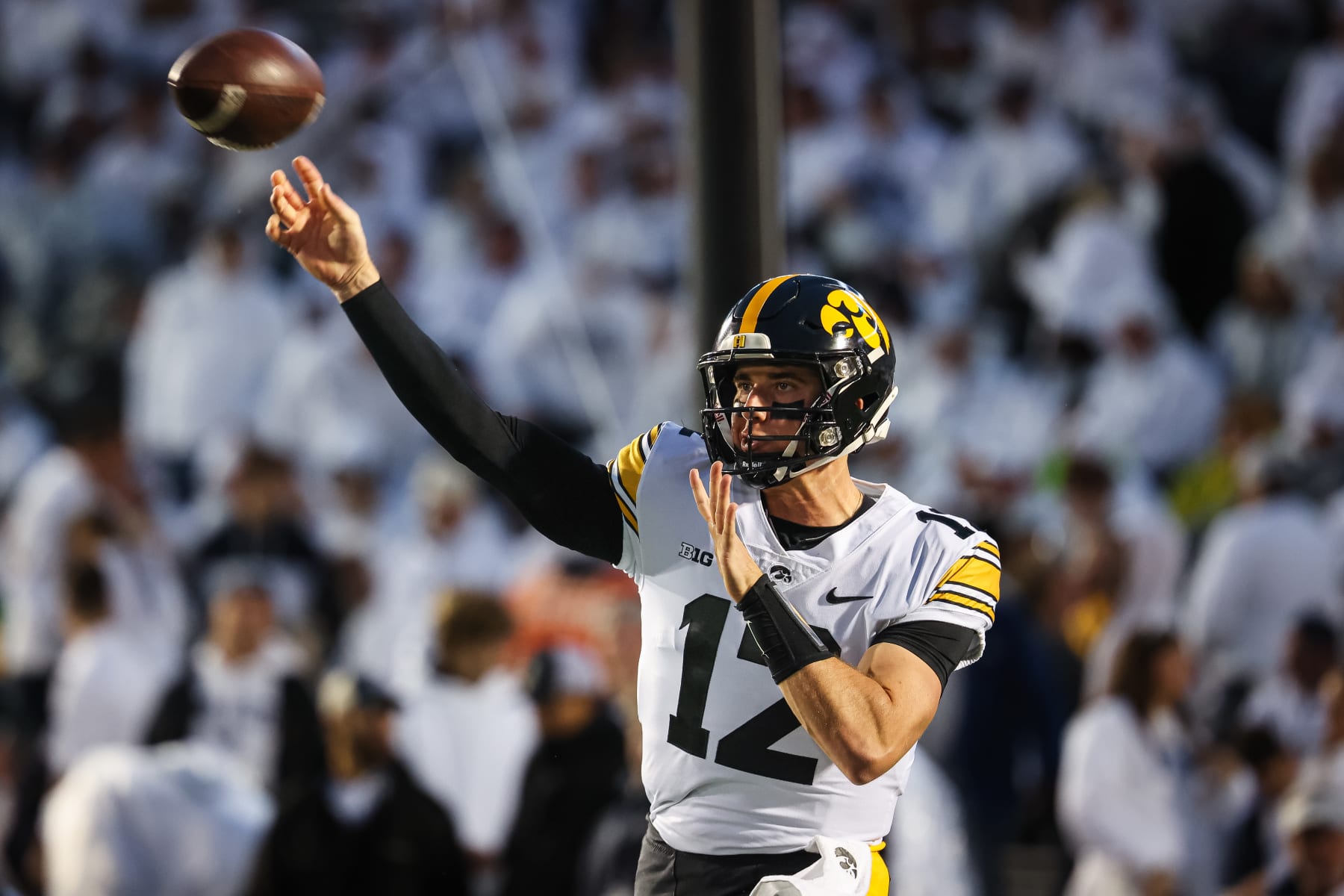 STATE COLLEGE, PA - SEPTEMBER 23: Cade McNamara #12 of the Iowa Hawkeyes warms up before the game against the Penn State Nittany Lions at Beaver Stadium on September 23, 2023 in State College, Pennsylvania. (Photo by Scott Taetsch/Getty Images)