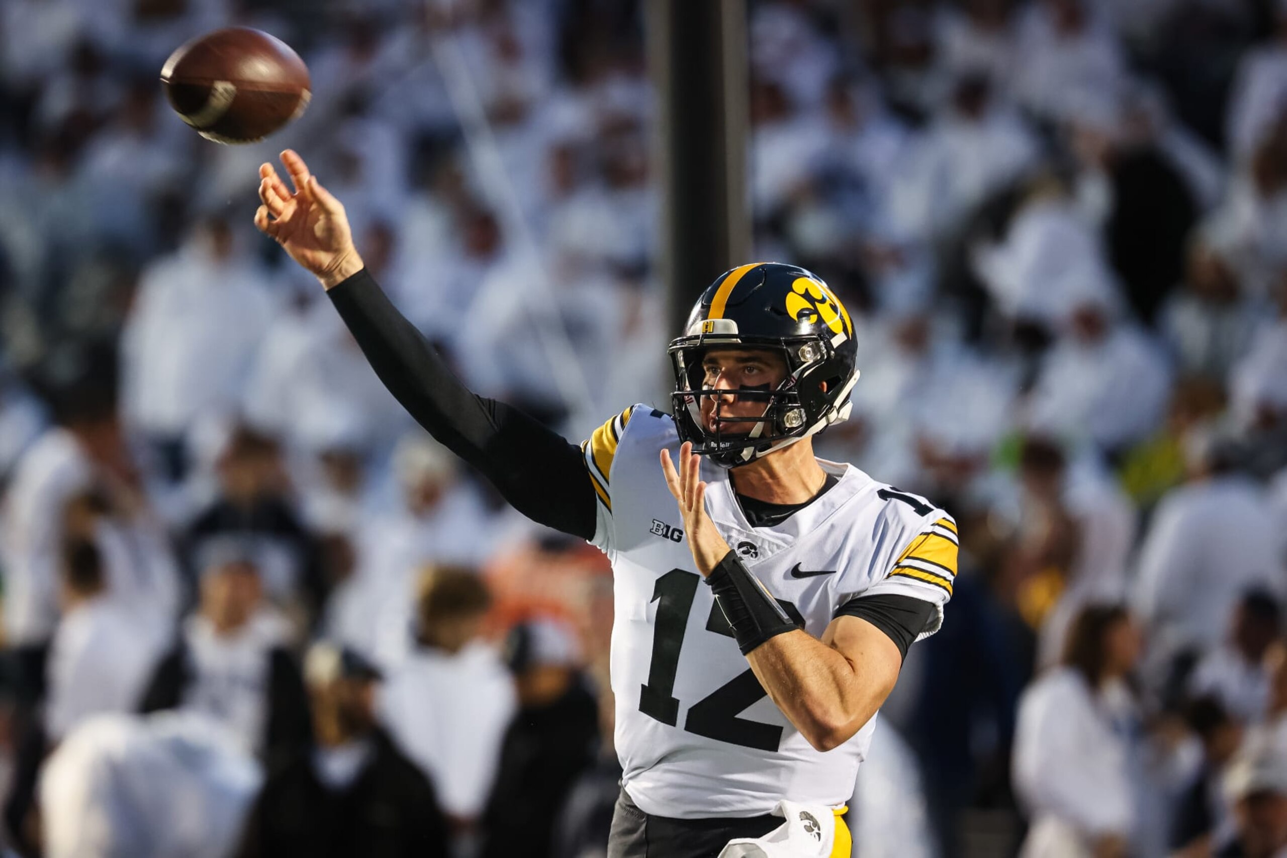 STATE COLLEGE, PA - SEPTEMBER 23: Cade McNamara #12 of the Iowa Hawkeyes warms up before the game against the Penn State Nittany Lions at Beaver Stadium on September 23, 2023 in State College, Pennsylvania. (Photo by Scott Taetsch/Getty Images)