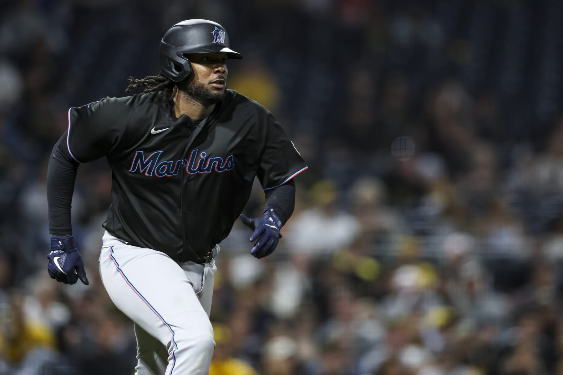 PITTSBURGH, PENNSYLVANIA - SEPTEMBER 29: Josh Bell #9 of the Miami Marlins rounds the bases as Garrett Hampson #1 and Nick Fortes #4 score during the eighth inning of the game against the Pittsburgh Pirates at PNC Park on September 29, 2023 in Pittsburgh, Pennsylvania. (Photo by Lauren Leigh Bacho/Getty Images)