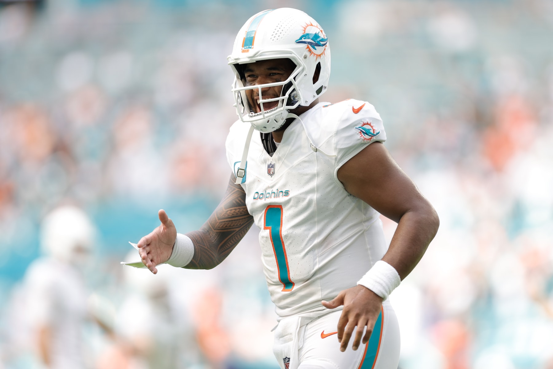 MIAMI GARDENS, FLORIDA - SEPTEMBER 24: Tua Tagovailoa #1 of the Miami Dolphins reacts after a touchdown during the fourth quarter against the Denver Broncos at Hard Rock Stadium on September 24, 2023 in Miami Gardens, Florida. (Photo by Carmen Mandato/Getty Images)