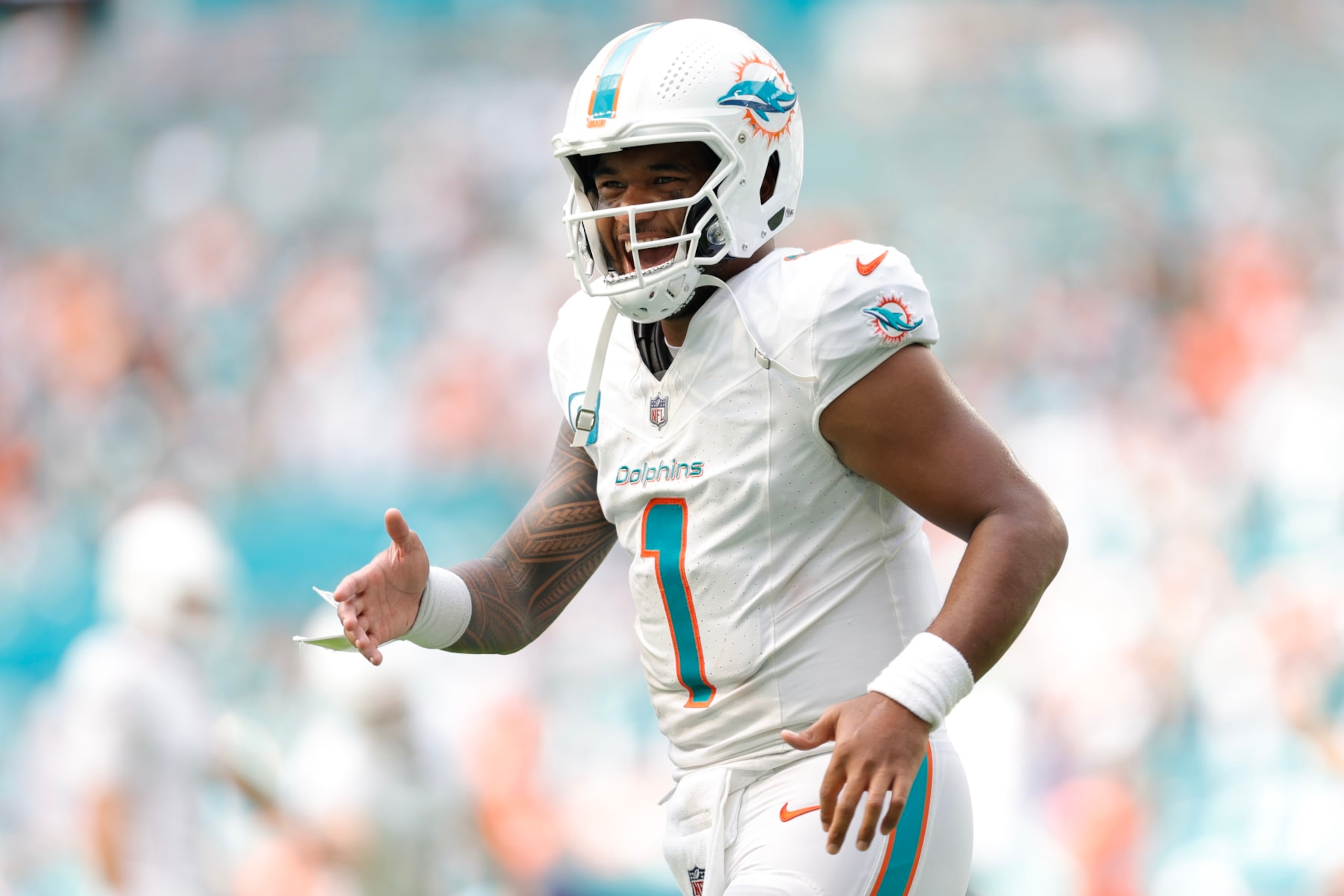MIAMI GARDENS, FLORIDA - SEPTEMBER 24: Tua Tagovailoa #1 of the Miami Dolphins reacts after a touchdown during the fourth quarter against the Denver Broncos at Hard Rock Stadium on September 24, 2023 in Miami Gardens, Florida. (Photo by Carmen Mandato/Getty Images)