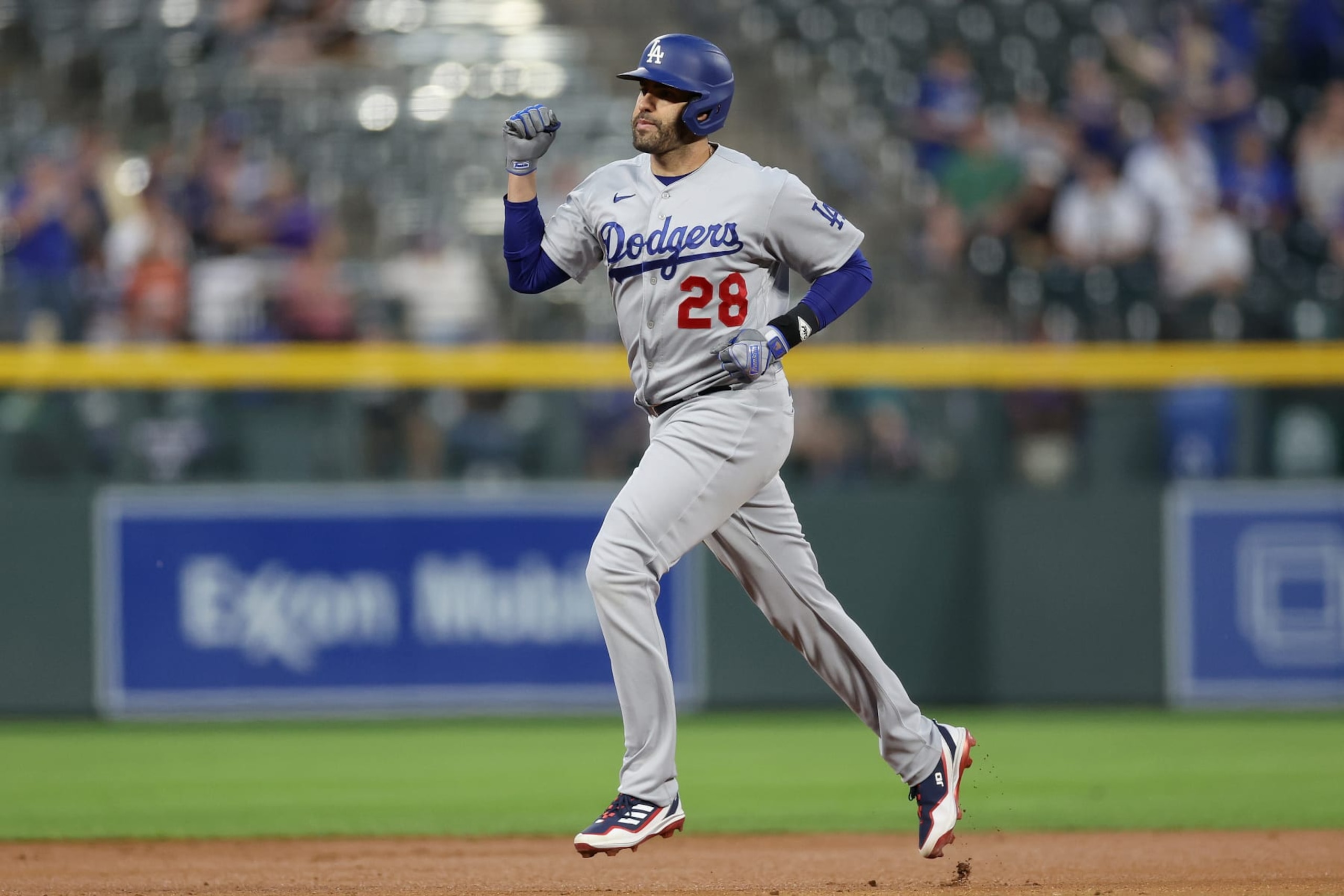 DENVER, COLORADO - SEPTEMBER 28: J.D. Martinez #28 of the Los Angeles Dodgers gestures as he circle the bases after hitting a two RBI home run against the Colorado Rockies in the first inning at Coors Field on September 28, 2023 in Denver, Colorado. (Photo by Matthew Stockman/Getty Images)