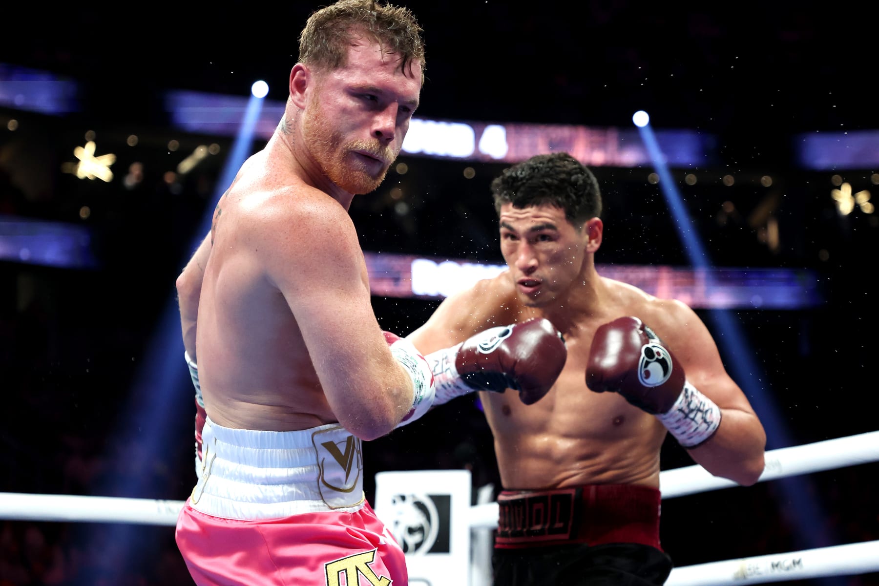 LAS VEGAS, NEVADA - MAY 07: Dmitry Bivol (R)punches Canelo Alvarez during their WBA light heavyweight title fight at T-Mobile Arena on May 07, 2022 in Las Vegas, Nevada. Bivol retained his title by unanimous decision. (Photo by Al Bello/Getty Images)