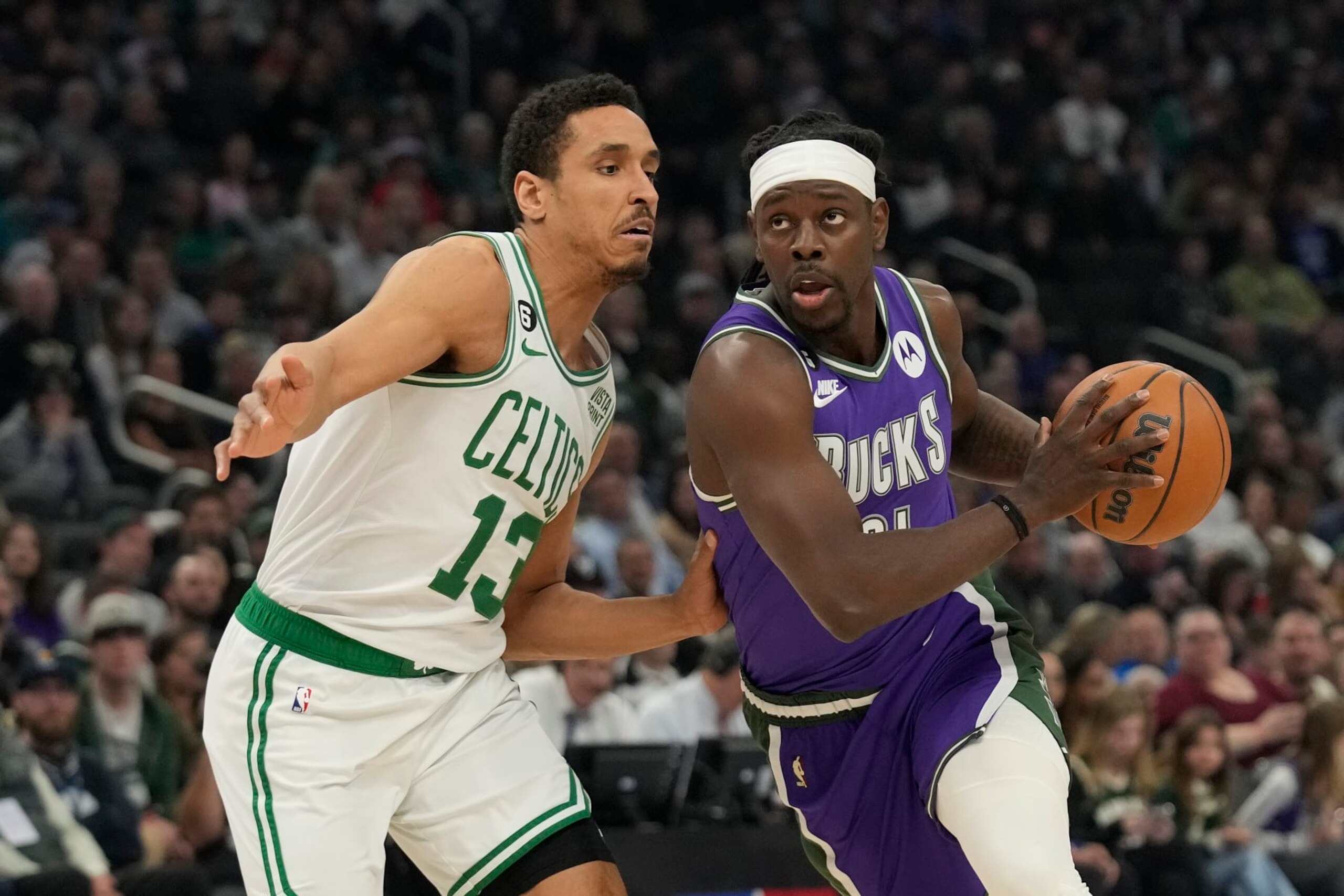 MILWAUKEE, WISCONSIN - MARCH 30: Jrue Holiday #21 of the Milwaukee Bucks dribbles the ball against Malcolm Brogdon #13 of the Boston Celtics in the first half at Fiserv Forum on March 30, 2023 in Milwaukee, Wisconsin. NOTE TO USER: User expressly acknowledges and agrees that, by downloading and or using this photograph, user is consenting to the terms and conditions of the Getty Images License Agreement. (Photo by Patrick McDermott/Getty Images) MILWAUKEE, WISCONSIN - MARCH 30: Jrue Holiday #21 of the Milwaukee Bucks dribbles the ball against Malcolm Brogdon #13 of the Boston Celtics in the first half at Fiserv Forum on March 30, 2023 in Milwaukee, Wisconsin. NOTE TO USER: User expressly acknowledges and agrees that, by downloading and or using this photograph, user is consenting to the terms and conditions of the Getty Images License Agreement. (Photo by Patrick McDermott/Getty Images)