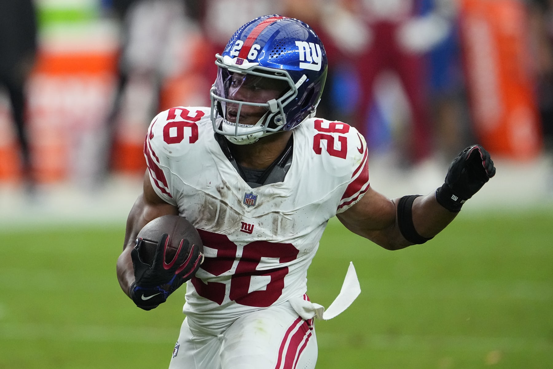 New York Giants running back Saquon Barkley (26) runs against the Arizona Cardinals during the second half of an NFL football game, Sunday, Sept. 17, 2023, in Glendale, Ariz. (AP Photo/Matt York)