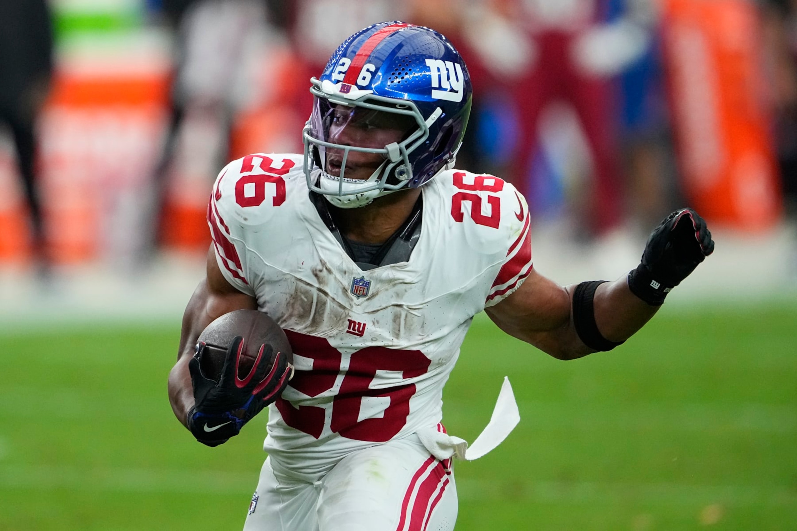 New York Giants running back Saquon Barkley (26) runs against the Arizona Cardinals during the second half of an NFL football game, Sunday, Sept. 17, 2023, in Glendale, Ariz. (AP Photo/Matt York)