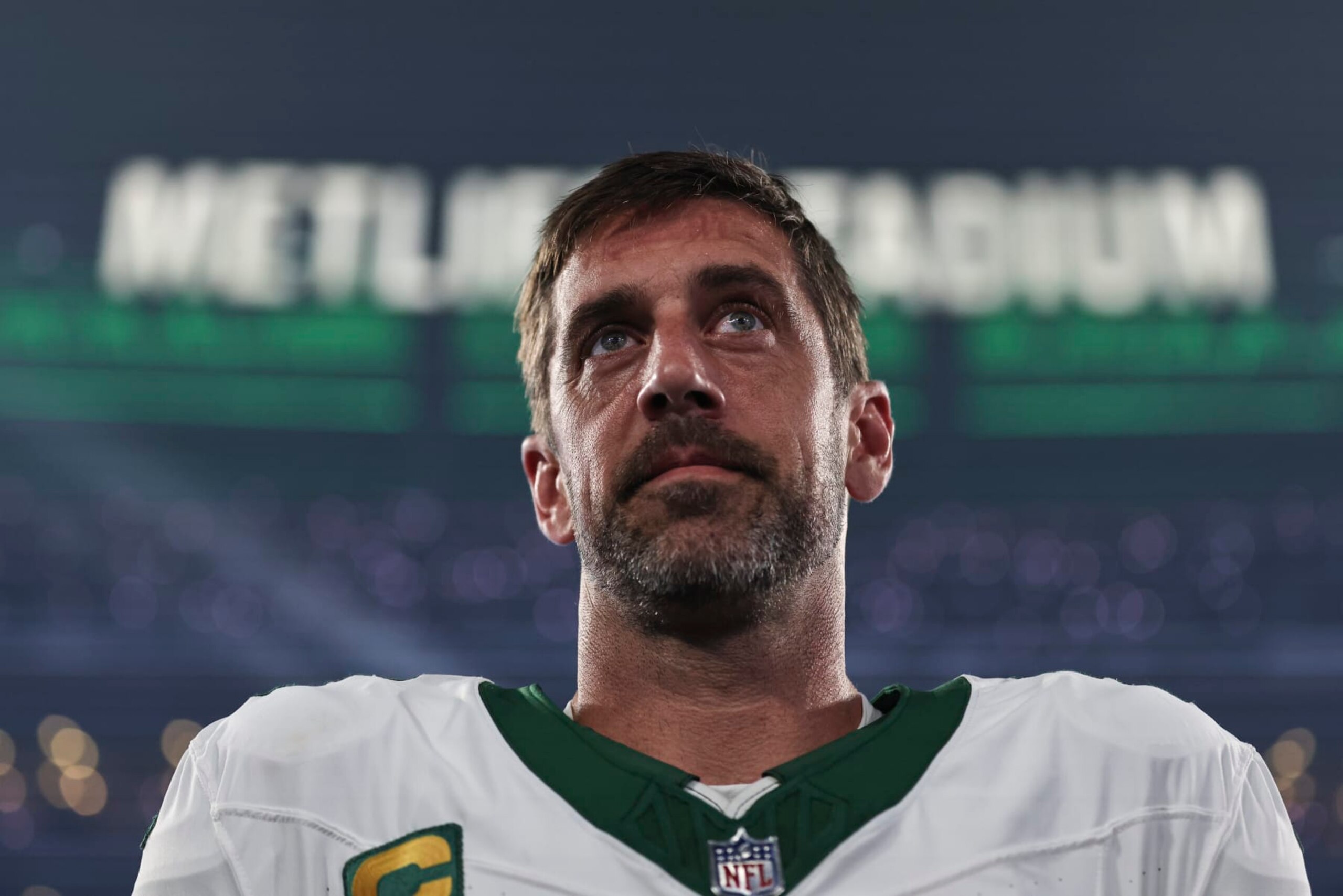 EAST RUTHERFORD, NEW JERSEY - SEPTEMBER 11: Aaron Rodgers #8 of the New York Jets looks on during the national anthem prior to a game against the Buffalo Bills at MetLife Stadium on September 11, 2023 in East Rutherford, New Jersey. (Photo by Michael Owens/Getty Images)
