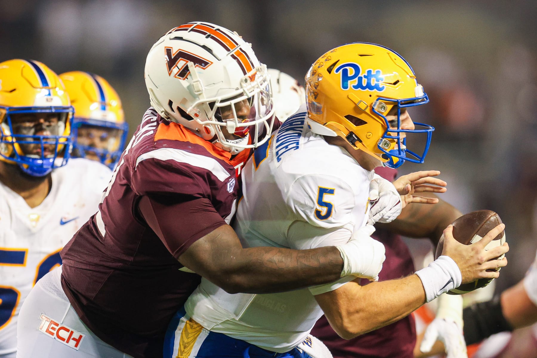 BLACKSBURG, VIRGINIA - SEPTEMBER 30: Mario Kendricks #22 of the Virginia Tech Hokies sacks Phil Jurkovec #5 of the Pittsburgh Panthers in the second half during a game  at Lane Stadium on September 30, 2023 in Blacksburg, Virginia. (Photo by Ryan Hunt/Getty Images)