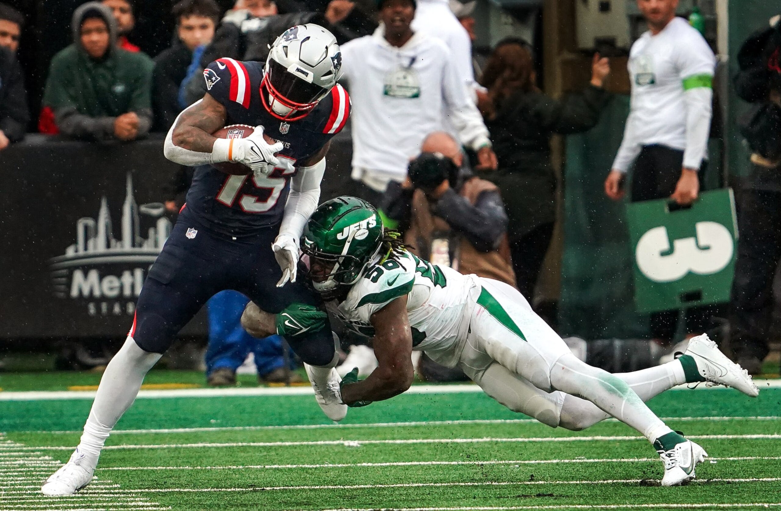 East Rutherford, NJ - September 24: New England Patriots RB Ezekiel Elliott is tackled by New York Jets LB Quincy Williams in the third quarter. The Patriots beat the Jets, 15-10. (Photo by Barry Chin/The Boston Globe via Getty Images) East Rutherford, NJ - September 24: New England Patriots RB Ezekiel Elliott is tackled by New York Jets LB Quincy Williams in the third quarter. The Patriots beat the Jets, 15-10. (Photo by Barry Chin/The Boston Globe via Getty Images)