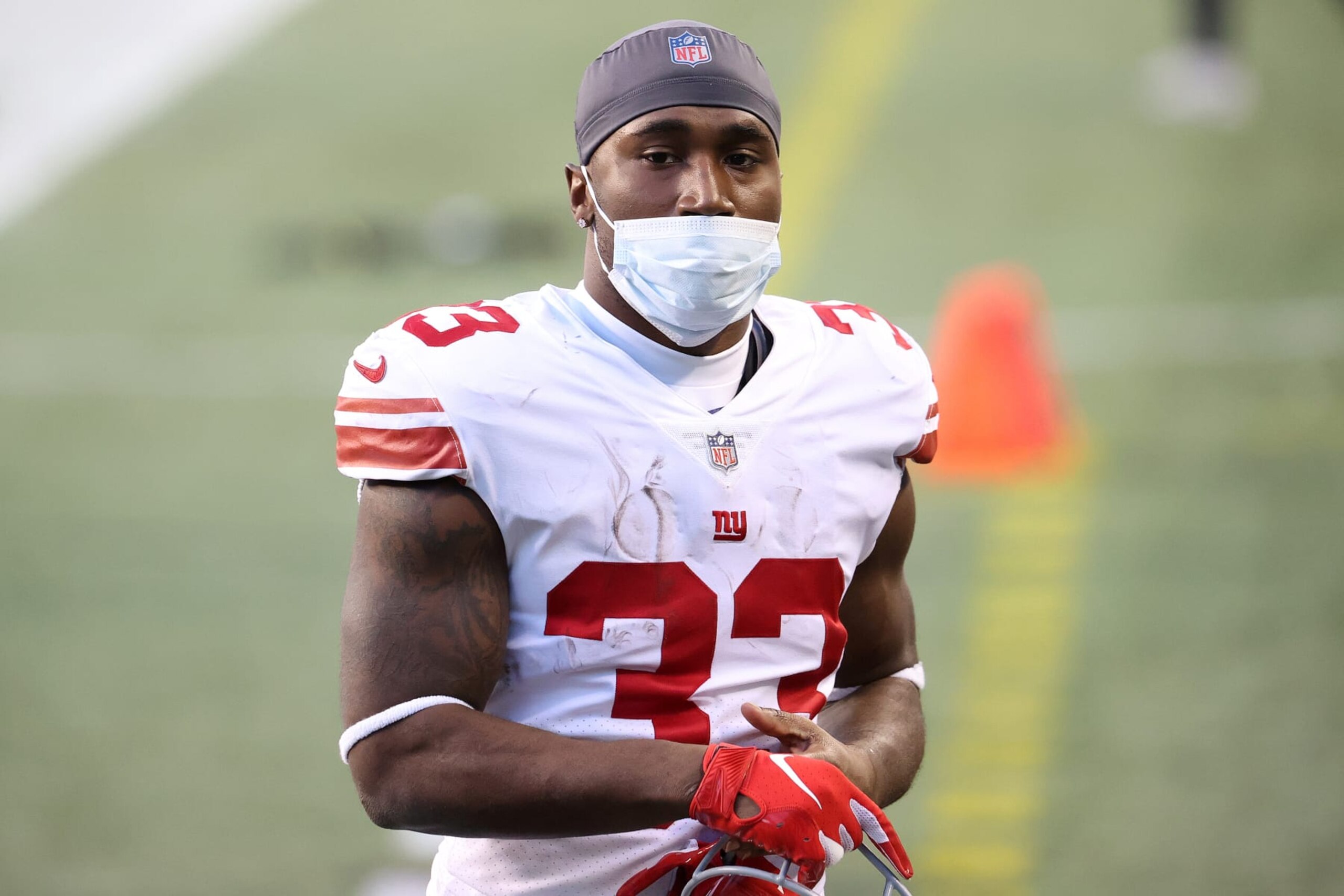 SEATTLE, WASHINGTON - DECEMBER 06: Dion Lewis #33 of the New York Giants exits the field after their 17-12 win against the Seattle Seahawks at Lumen Field on December 06, 2020 in Seattle, Washington. (Photo by Abbie Parr/Getty Images) SEATTLE, WASHINGTON - DECEMBER 06: Dion Lewis #33 of the New York Giants exits the field after their 17-12 win against the Seattle Seahawks at Lumen Field on December 06, 2020 in Seattle, Washington. (Photo by Abbie Parr/Getty Images)