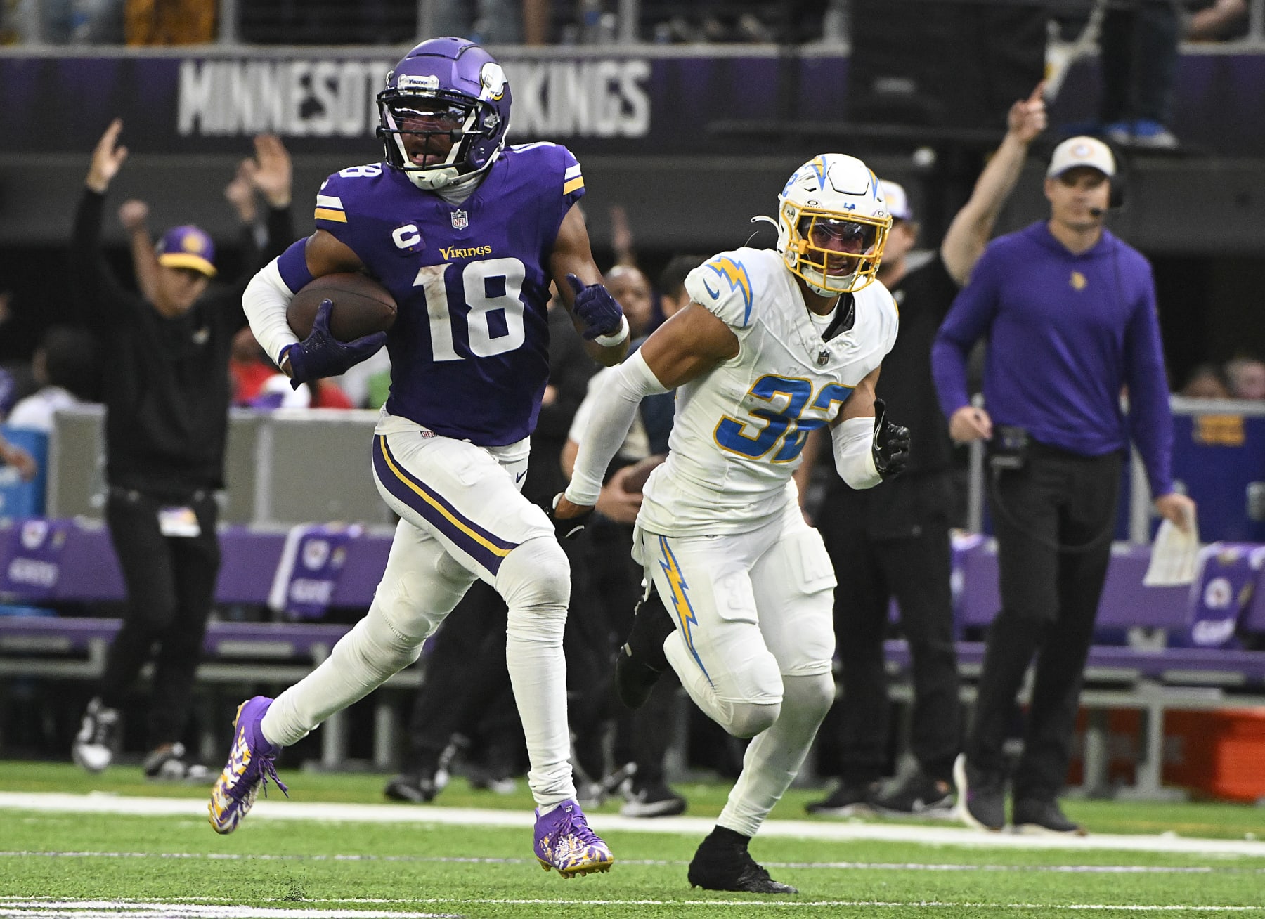MINNEAPOLIS, MINNESOTA - SEPTEMBER 24: Alohi Gilman #32 of the Los Angeles Chargers pursues Justin Jefferson #18 of the Minnesota Vikings during the fourth quarter at U.S. Bank Stadium on September 24, 2023 in Minneapolis, Minnesota. (Photo by Stephen Maturen/Getty Images)