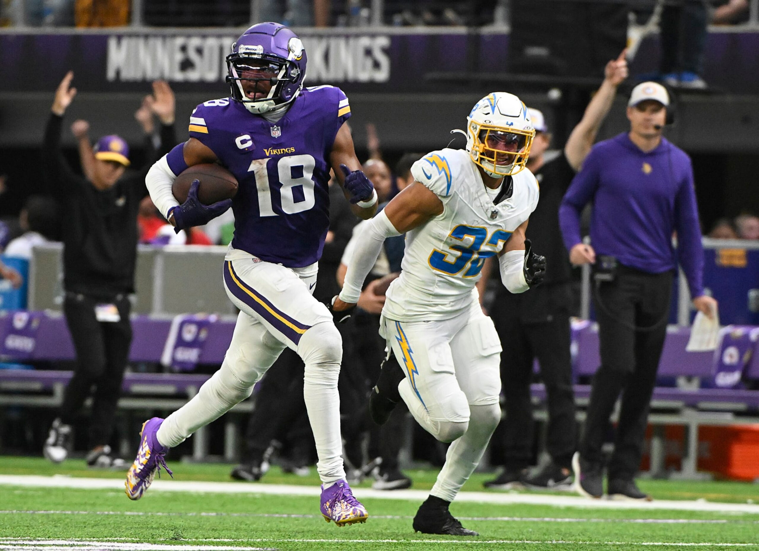MINNEAPOLIS, MINNESOTA - SEPTEMBER 24: Alohi Gilman #32 of the Los Angeles Chargers pursues Justin Jefferson #18 of the Minnesota Vikings during the fourth quarter at U.S. Bank Stadium on September 24, 2023 in Minneapolis, Minnesota. (Photo by Stephen Maturen/Getty Images)