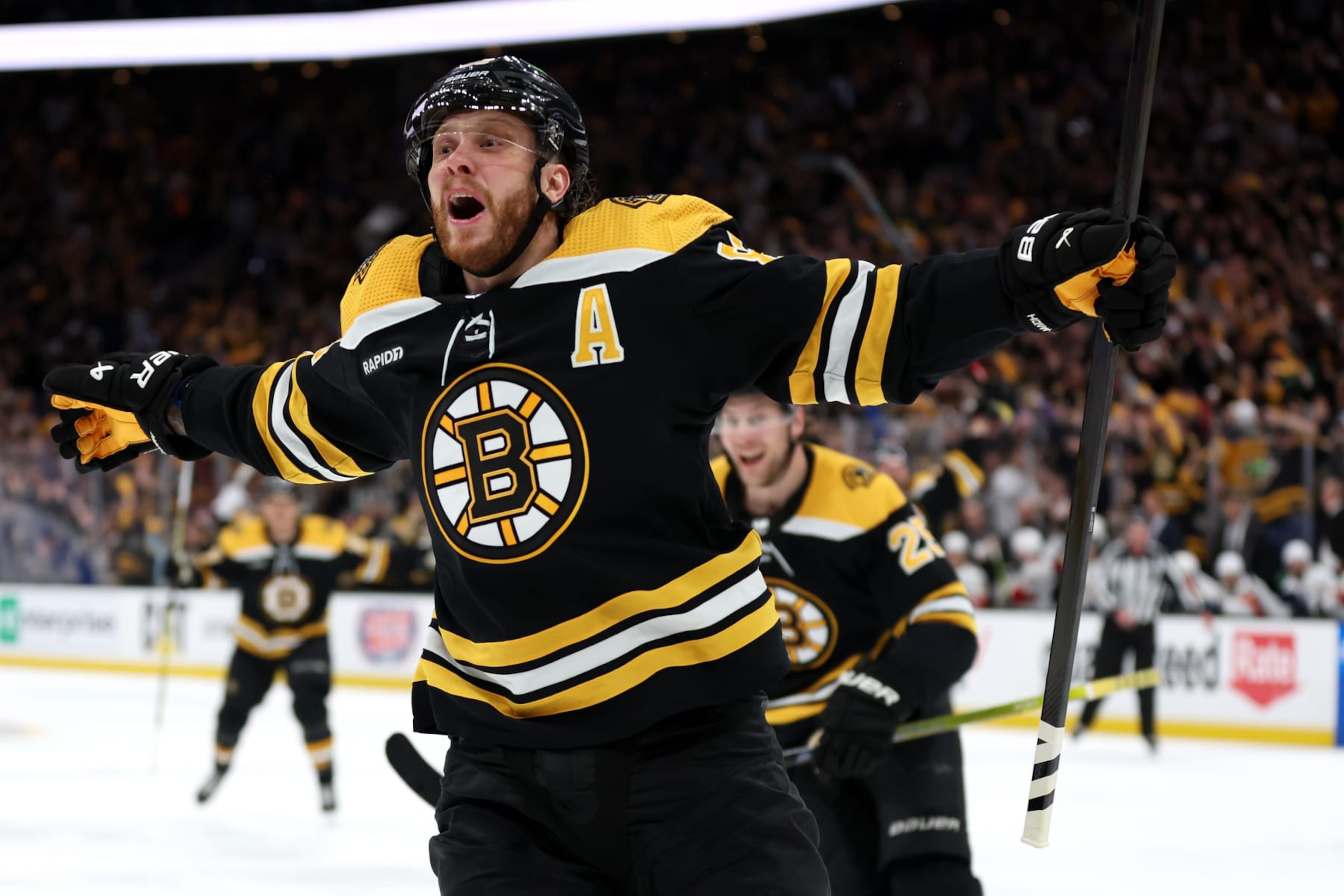 BOSTON, MASSACHUSETTS - APRIL 30: David Pastrnak #88 of the Boston Bruins celebrates with Brandon Carlo #25 after scoring a goal against the Florida Panthers during the third period in Game Seven of the First Round of the 2023 Stanley Cup Playoffs at TD Garden on April 30, 2023 in Boston, Massachusetts. (Photo by Maddie Meyer/Getty Images)