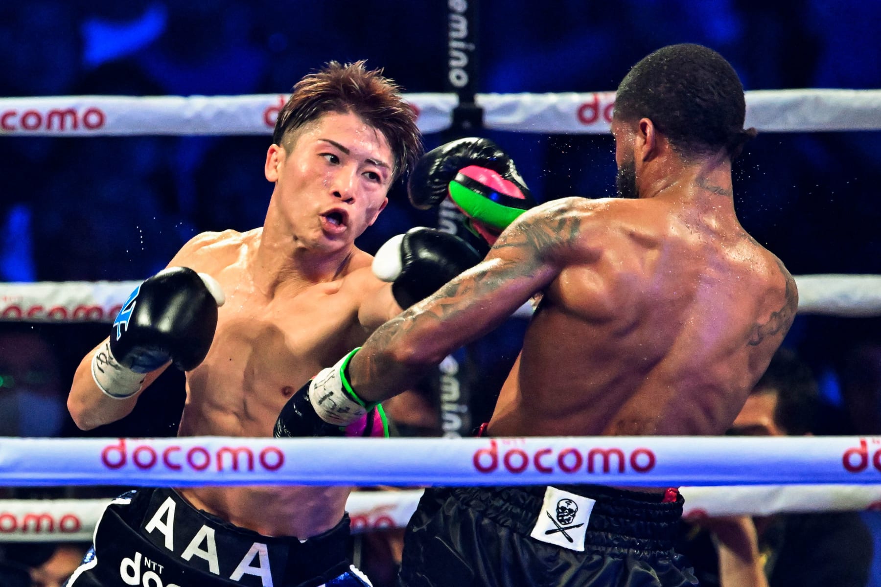 Naoya Inoue of Japan (L) and Stephen Fulton of the US fight in the WBC, WBO super bantamweight world title match at Ariake Arena in Tokyo on July 25, 2023. (Photo by Kazuhiro NOGI / AFP) (Photo by KAZUHIRO NOGI/AFP via Getty Images)