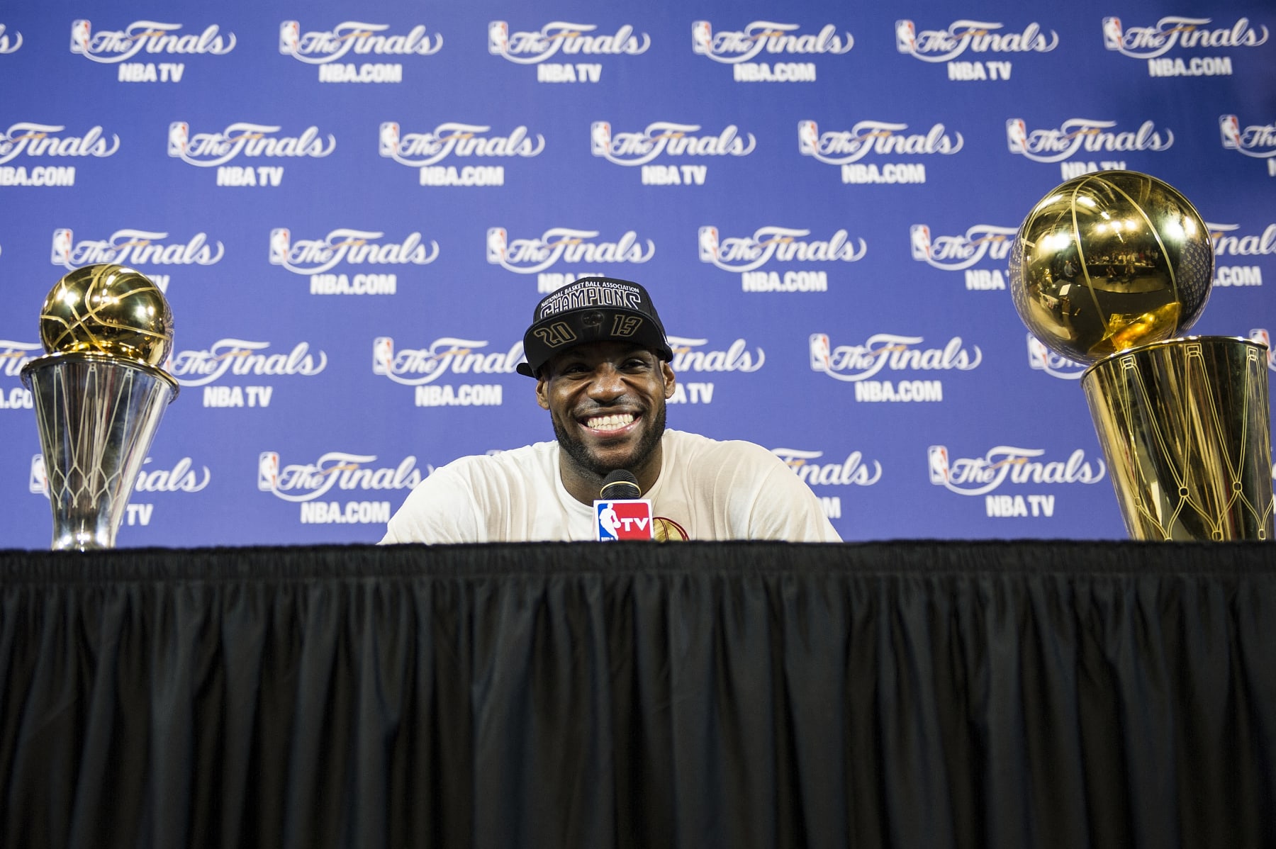 LeBron James of the Miami Heat speaks with reporters after Game 7 of the NBA Finals at the American Airlines Arena June 20, 2013 in Miami, Florida. The Miami Heat beat the San Antonio Spurs 95-88 to become the 2013 NBA champions. AFP PHOTO/Brendan SMIALOWSKI (Photo by Brendan SMIALOWSKI / AFP) (Photo by BRENDAN SMIALOWSKI/AFP via Getty Images)
