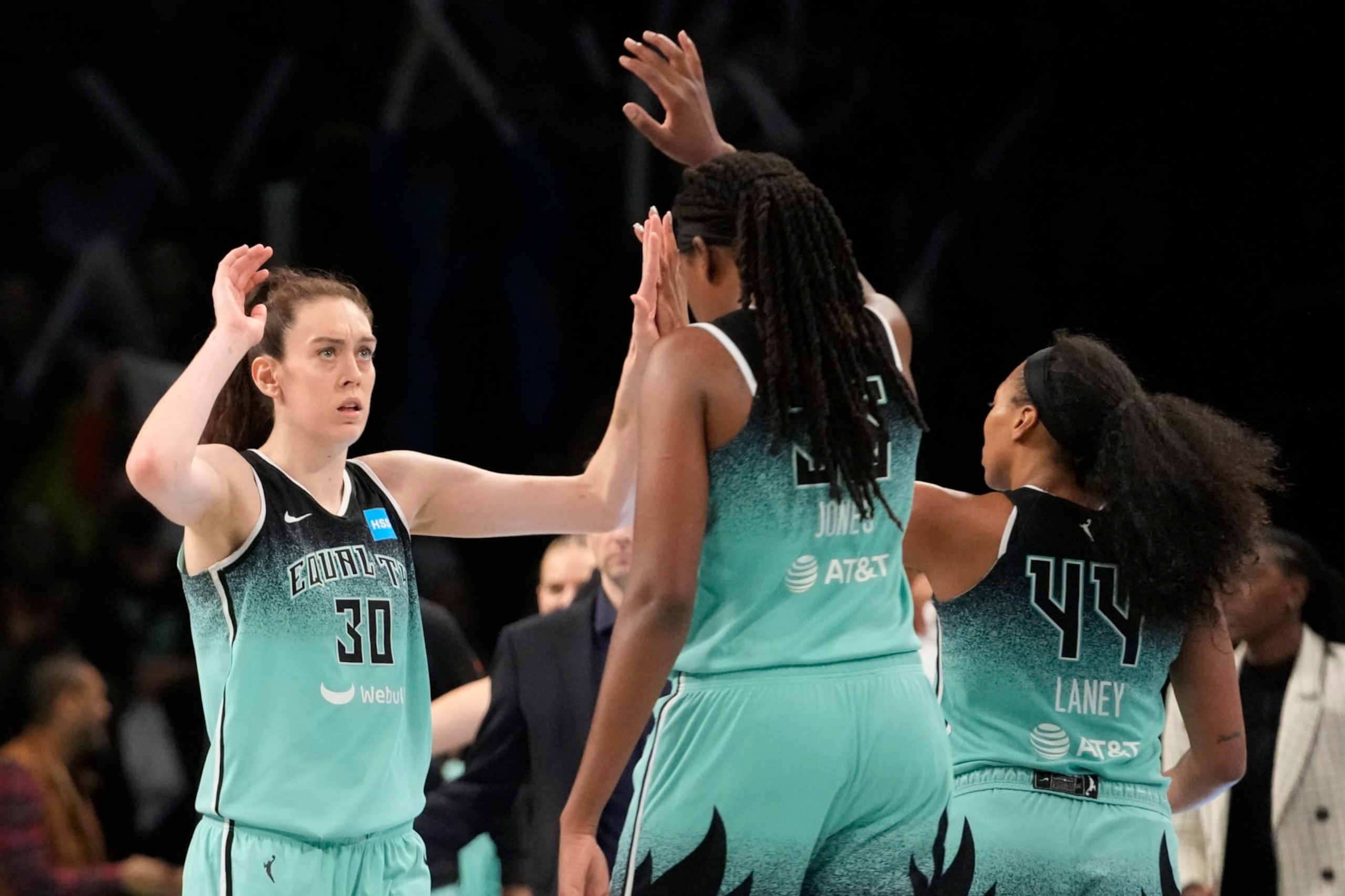 New York Liberty forward Breanna Stewart (30) and forward Jonquel Jones (35) celebrate after Stewart scored a three-point basket during the second half of Game 2 of a WNBA basketball playoffs semifinal against the Connecticut Sun, Tuesday, Sept. 26, 2023, in New York. The Liberty won 84-77. (AP Photo/Mary Altaffer)