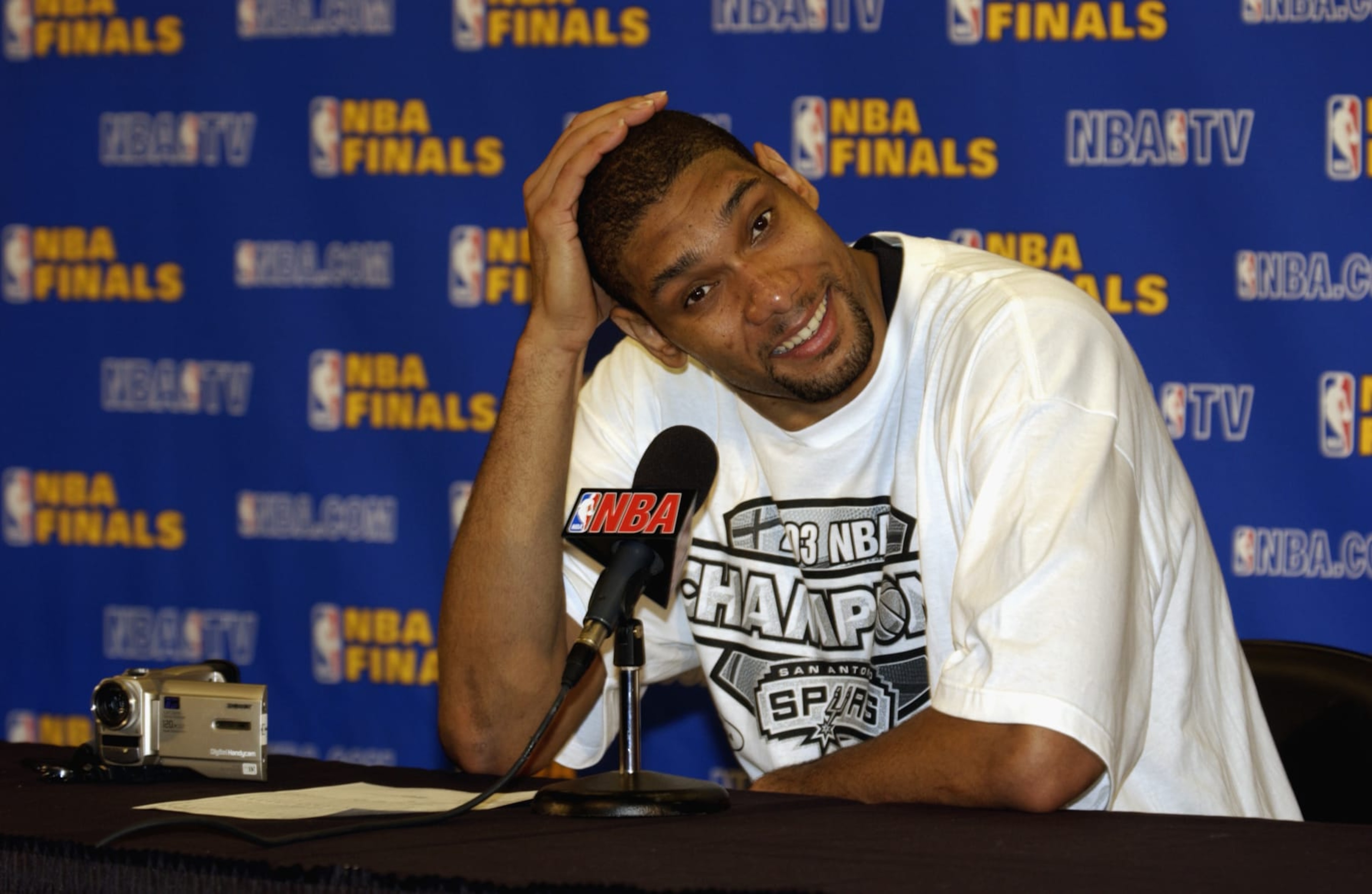 SAN ANTONIO - JUNE 15: Tim Duncan #50 of the San Antonio Spurs talks to the media after Game six of the 2003 NBA Finals against the New Jersey Nets at SBC Center on June 15, 2003 in San Antonio, Texas. The Spurs won 88-77 and defeated the Nets to win the NBA Championship. NOTE TO USER: User expressly acknowledges and agrees that, by downloading and/or using this Photograph, User is consenting to the terms and conditions of the Getty Images License Agreement Mandatory Copyright Notice: Copyright 2003 NBAE (Photo by D. Clarke Evans/NBAE via Getty Images) SAN ANTONIO - JUNE 15: Tim Duncan #50 of the San Antonio Spurs talks to the media after Game six of the 2003 NBA Finals against the New Jersey Nets at SBC Center on June 15, 2003 in San Antonio, Texas. The Spurs won 88-77 and defeated the Nets to win the NBA Championship. NOTE TO USER: User expressly acknowledges and agrees that, by downloading and/or using this Photograph, User is consenting to the terms and conditions of the Getty Images License Agreement Mandatory Copyright Notice: Copyright 2003 NBAE (Photo by D. Clarke Evans/NBAE via Getty Images)