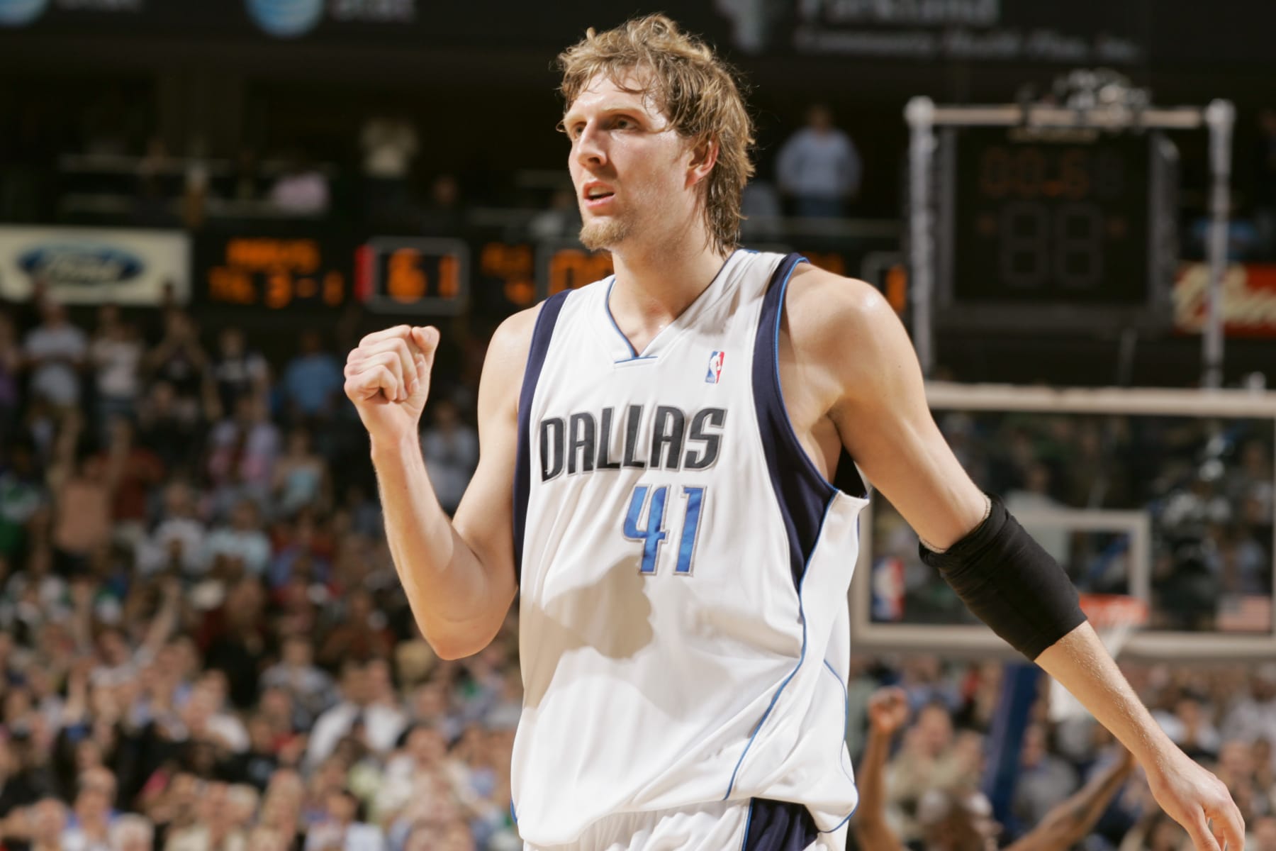 DALLAS - MARCH 14:  Dirk Nowitzki #41 of Dallas Mavericks celebrates during the game against the Cleveland Cavaliers at American Airlines Arena on March 14, 2006 in Dallas, Texas.  The Mavericks won 91-87.  NOTE TO USER: User expressly acknowledges and agrees that, by downloading and/or using this Photograph, user is consenting to the terms and conditions of the Getty Images License Agreement. Mandatory Copyright Notice: Copyright 2006 NBAE  (Photo by Tim Heitman/NBAE via Getty Images)