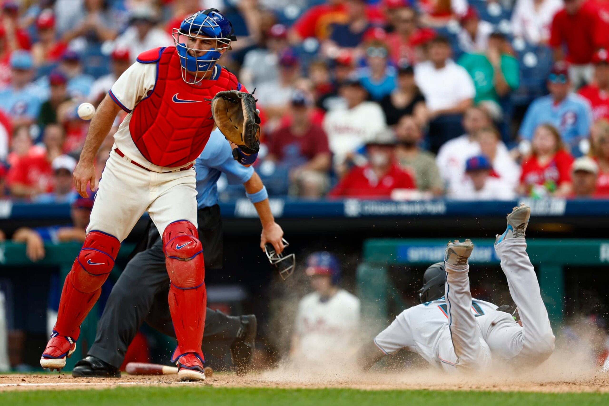 PHILADELPHIA, PENNSYLVANIA - SEPTEMBER 10: Yuli Gurriel #10 of the Miami Marlins slides in to score on a single by Nick Fortes (not in the picture) #4 as catcher J.T. Realmuto (L) #10 of the Philadelphia Phillies waits for the ball in the seventh inning at Citizens Bank Park on September 10, 2023 in Philadelphia, Pennsylvania. The Marlins defeated the Phillies 5-4. (Photo by Rich Schultz/Getty Images) PHILADELPHIA, PENNSYLVANIA - SEPTEMBER 10: Yuli Gurriel #10 of the Miami Marlins slides in to score on a single by Nick Fortes (not in the picture) #4 as catcher J.T. Realmuto (L) #10 of the Philadelphia Phillies waits for the ball in the seventh inning at Citizens Bank Park on September 10, 2023 in Philadelphia, Pennsylvania. The Marlins defeated the Phillies 5-4. (Photo by Rich Schultz/Getty Images)