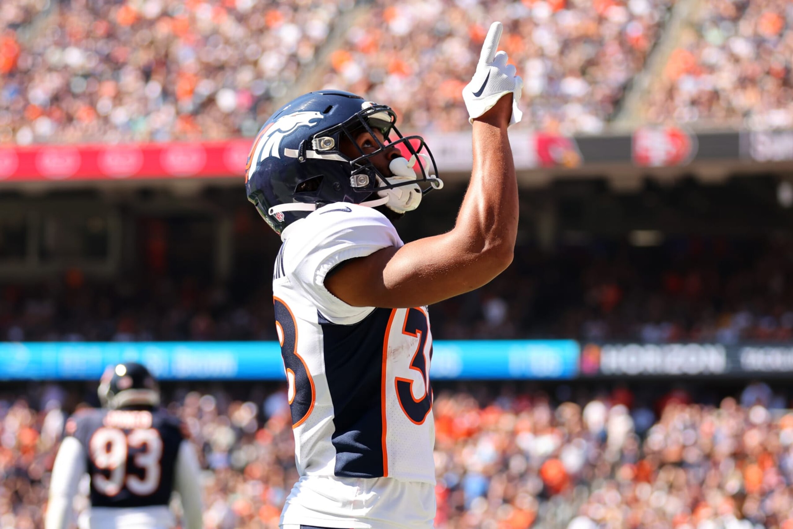 CHICAGO, ILLINOIS - OCTOBER 01: Jaleel McLaughlin #38 of the Denver Broncos celebrates scoring a touchdown against the Chicago Bears during the first quarter at Soldier Field on October 01, 2023 in Chicago, Illinois. (Photo by Michael Reaves/Getty Images)