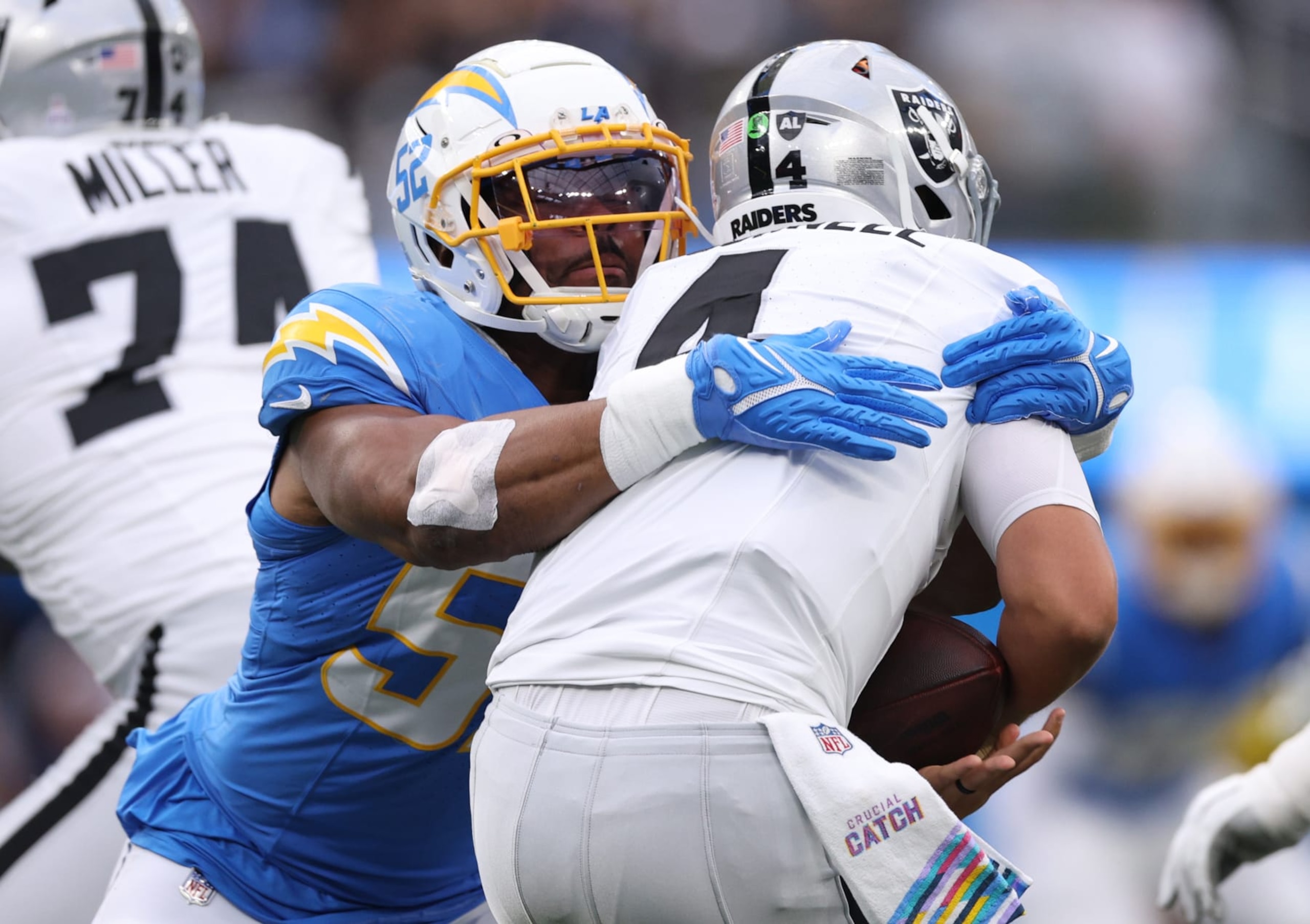INGLEWOOD, CALIFORNIA - OCTOBER 01: Khalil Mack #52 of the Los Angeles Chargers sacks Aidan O'Connell #4 of the Las Vegas Raiders during the first quarter at SoFi Stadium on October 01, 2023 in Inglewood, California. (Photo by Harry How/Getty Images)
