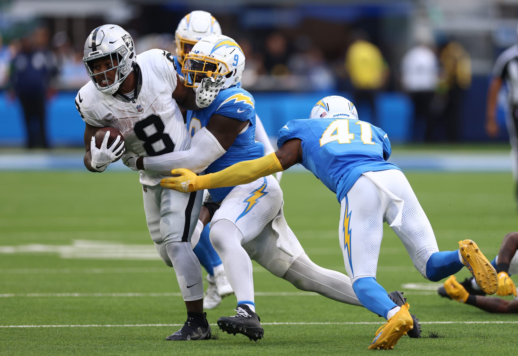 Raiders RB Josh Jacobs is tackles by Chargers LB  Kenneth Murray Jr.