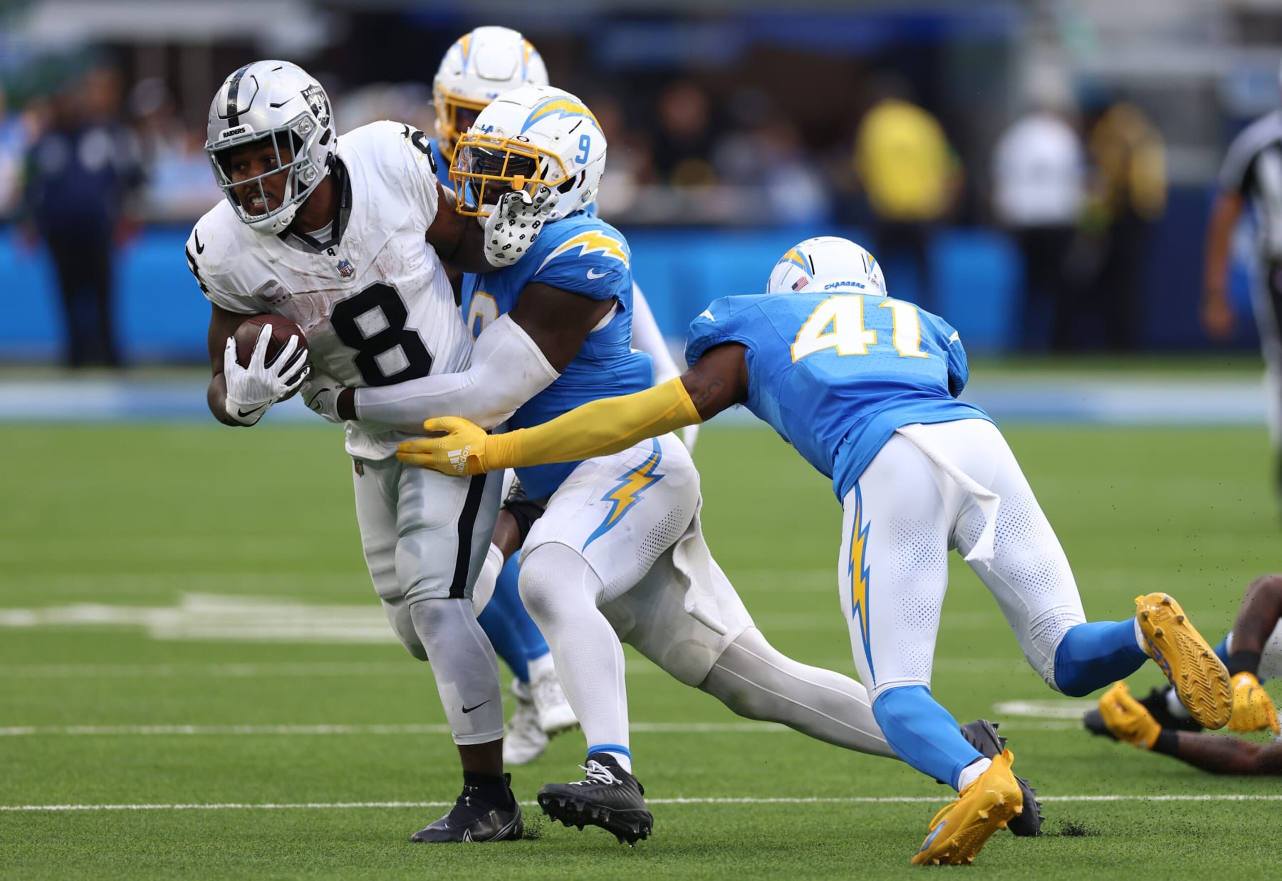 Raiders RB Josh Jacobs is tackles by Chargers LB  Kenneth Murray Jr.