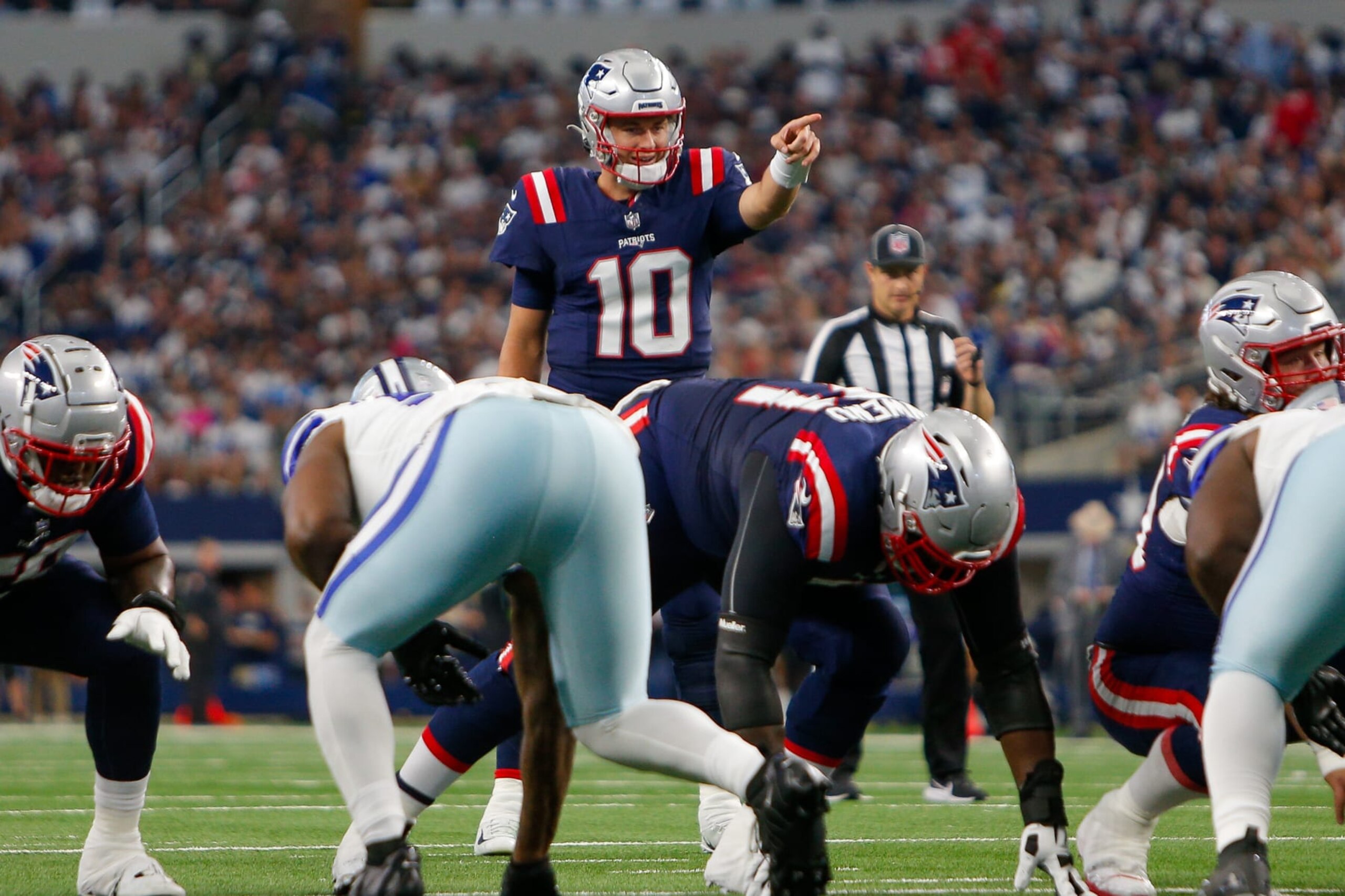 Patriots QB Mac Jones surveys the Cowboys defense