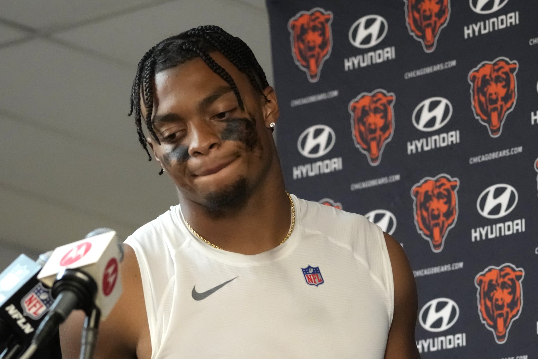 Chicago Bears quarterback Justin Fields walks to the podium after his team's 31-28 loss to the Denver Broncos after an NFL football game Sunday, Oct. 1, 2023, in Chicago. (AP Photo/Nam Y. Huh)