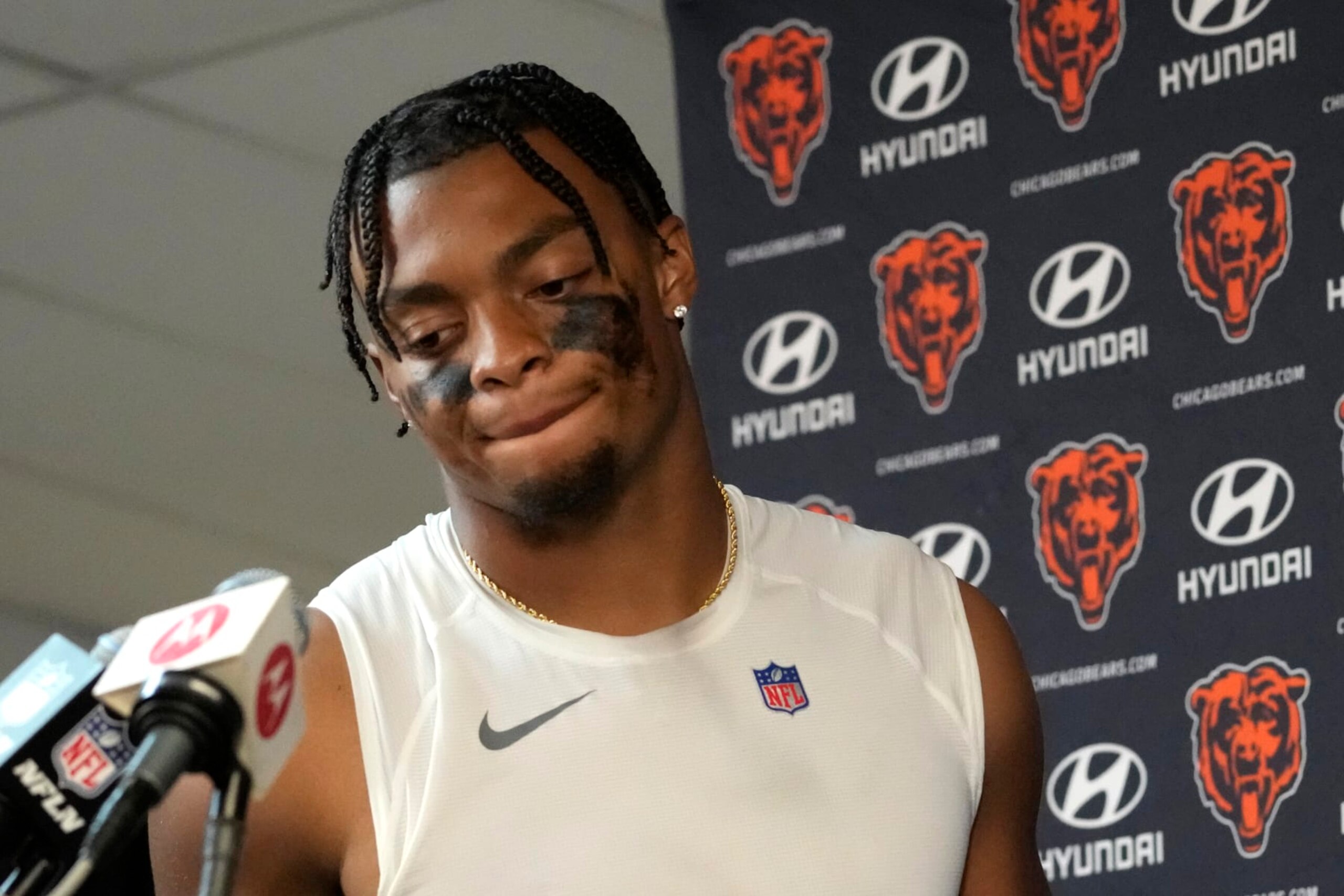Chicago Bears quarterback Justin Fields walks to the podium after his team's 31-28 loss to the Denver Broncos after an NFL football game Sunday, Oct. 1, 2023, in Chicago. (AP Photo/Nam Y. Huh)