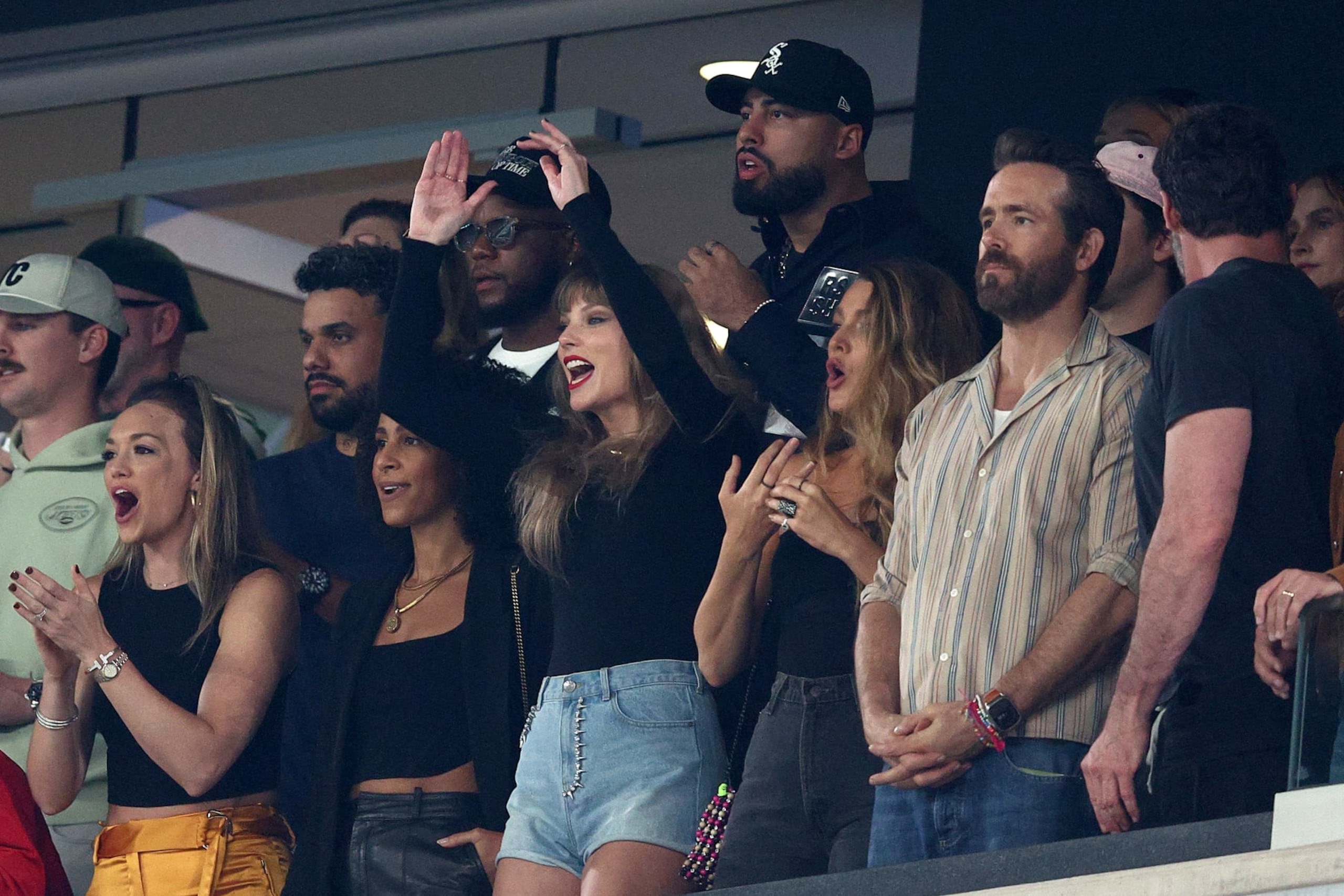 EAST RUTHERFORD, NEW JERSEY - OCTOBER 01: (L-R) Singer Taylor Swift, Actors Blake Lively and Ryan Reynolds cheer prior to the game between the Kansas City Chiefs and the New York Jets at MetLife Stadium on October 01, 2023 in East Rutherford, New Jersey. (Photo by Elsa/Getty Images)