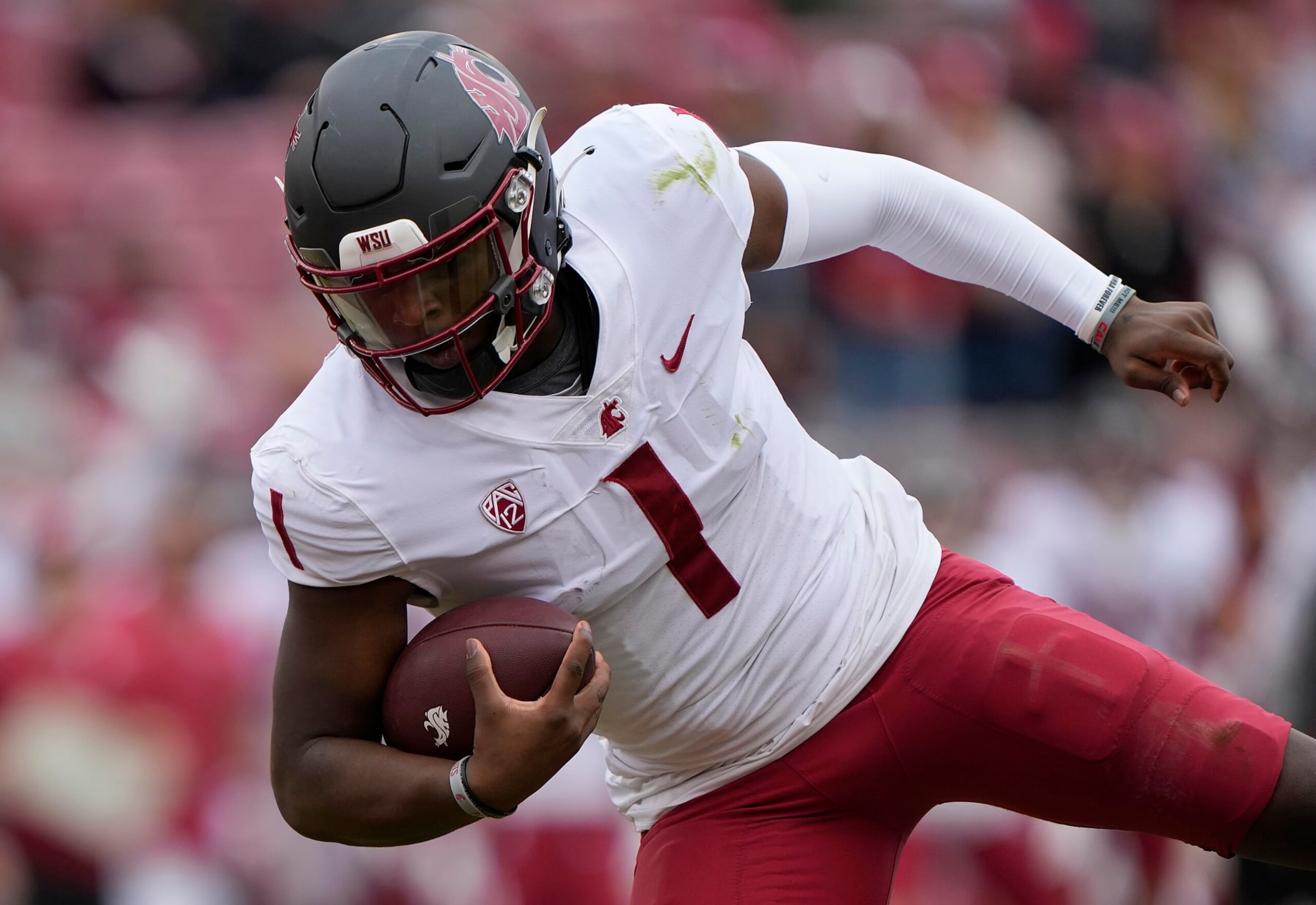 STANFORD, CALIFORNIA - NOVEMBER 05: Cameron Ward #1 of the Washington State Cougars rushes with the ball for a 15 yard touchdown run against the Stanford Cardinal during the first quarter of an NCAA football game at Stanford Stadium on November 05, 2022 in Stanford, California. (Photo by Thearon W. Henderson/Getty Images)