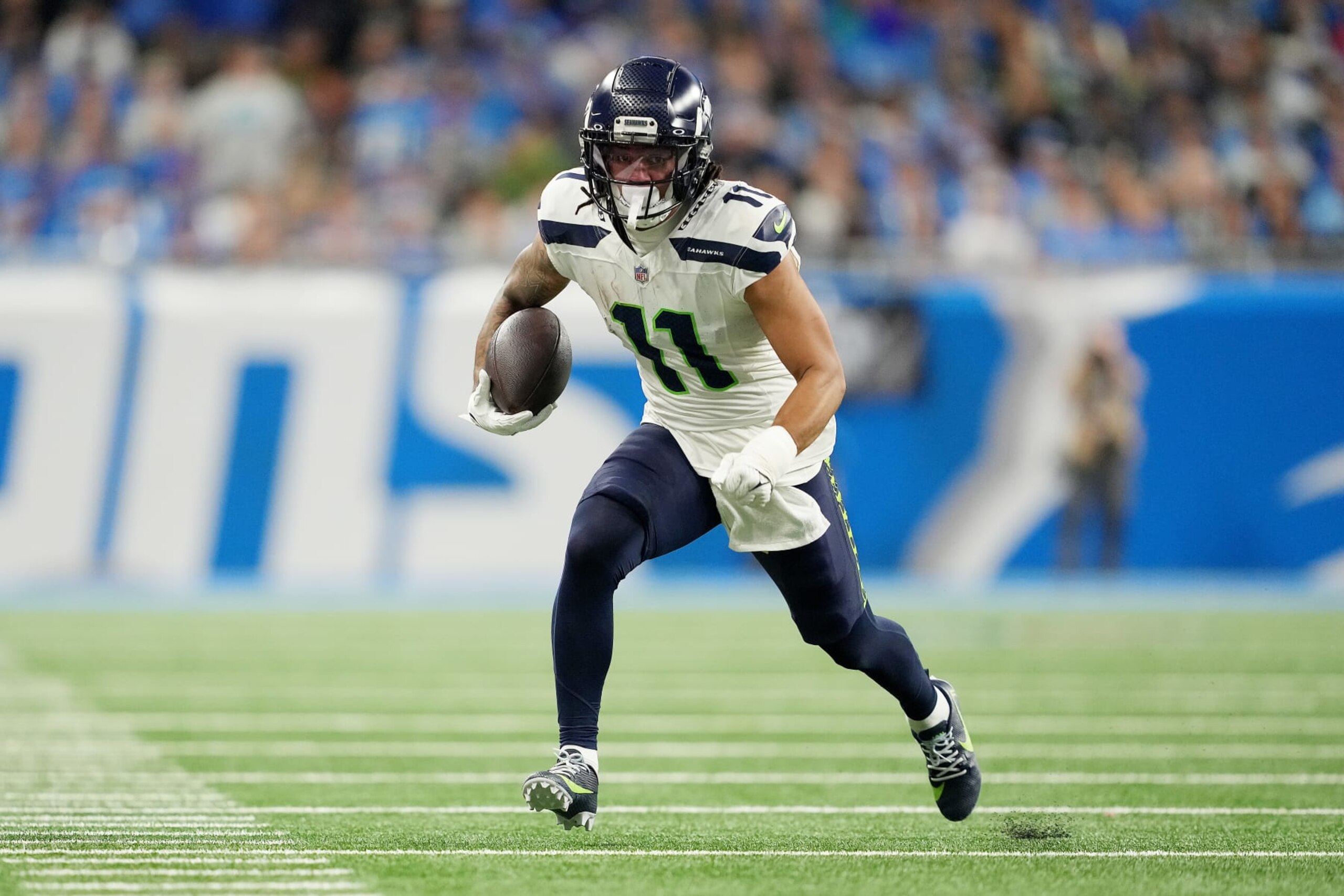 DETROIT, MICHIGAN - SEPTEMBER 17: Jaxon Smith-Njigba #11 of the Seattle Seahawks runs the ball during the fourth quarter in the game against the Detroit Lions at Ford Field on September 17, 2023 in Detroit, Michigan. (Photo by Nic Antaya/Getty Images)