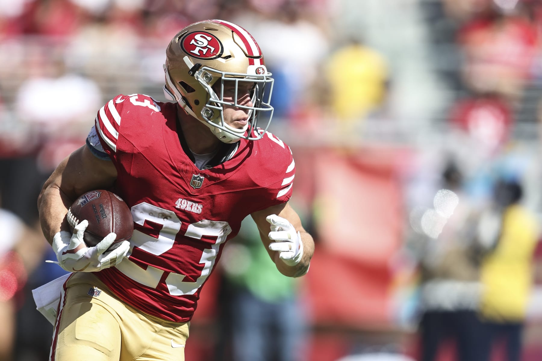 SANTA CLARA, CALIFORNIA - OCTOBER 01: Christian McCaffrey #23 of the San Francisco 49ers runs with the ball during an NFL football game between the San Francisco 49ers and the Arizona Cardinals at Levi's Stadium on October 01, 2023 in Santa Clara, California. (Photo by Michael Owens/Getty Images)