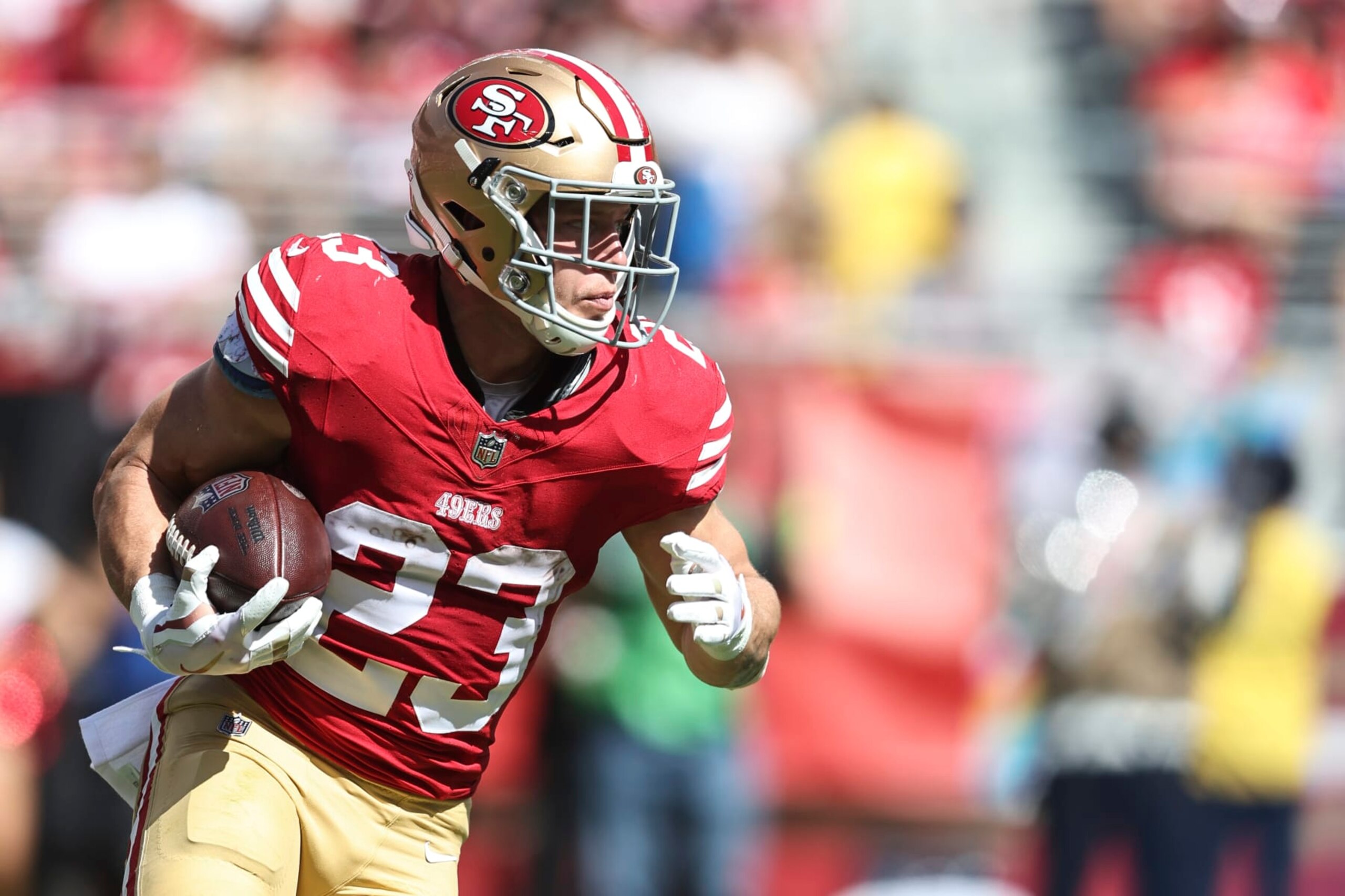 SANTA CLARA, CALIFORNIA - OCTOBER 01: Christian McCaffrey #23 of the San Francisco 49ers runs with the ball during an NFL football game between the San Francisco 49ers and the Arizona Cardinals at Levi's Stadium on October 01, 2023 in Santa Clara, California. (Photo by Michael Owens/Getty Images)