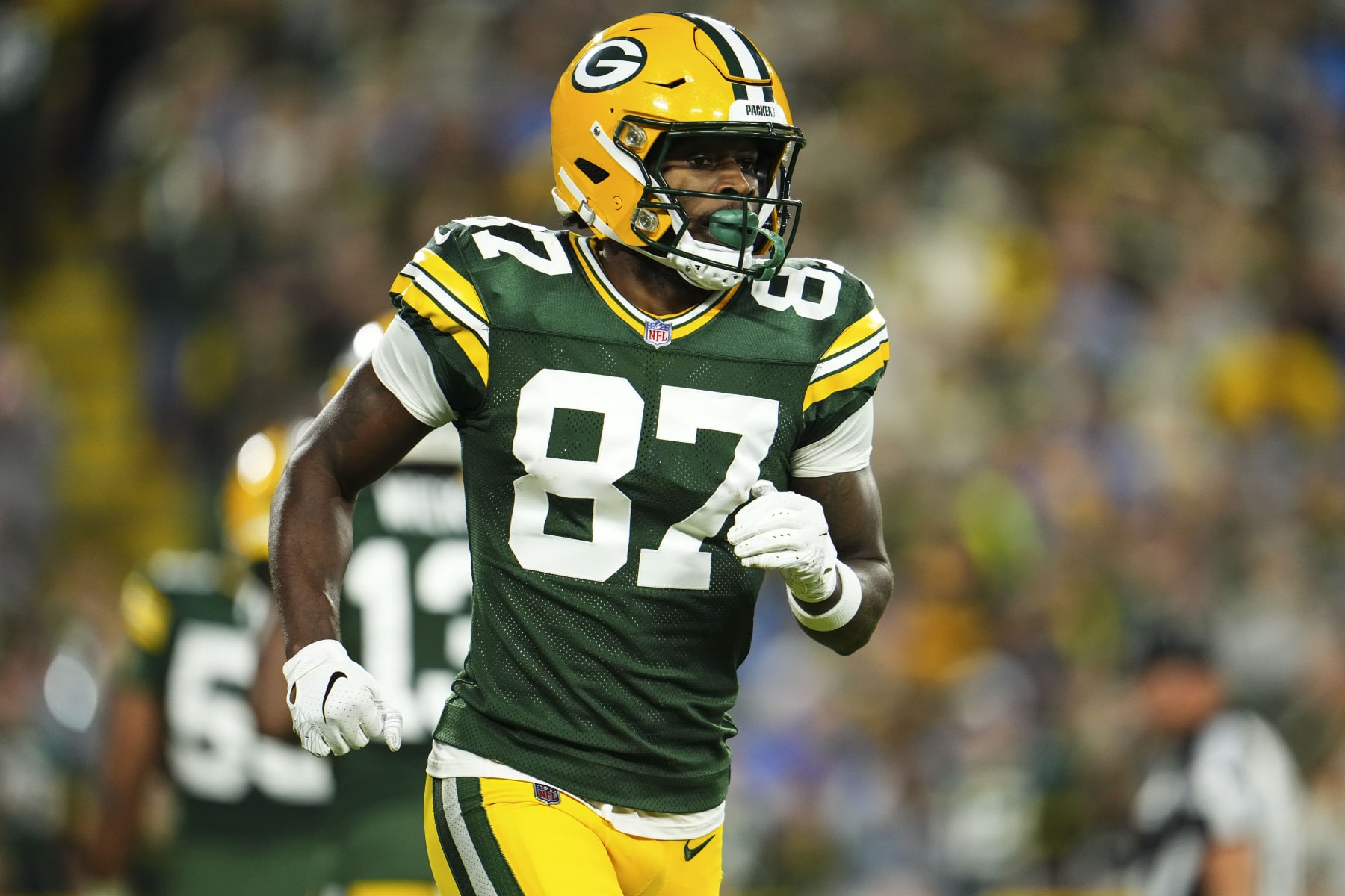 GREEN BAY, WI - SEPTEMBER 28: Romeo Doubs #87 of the Green Bay Packers runs off of the field during an NFL football game at Lambeau Field on September 28, 2023 in Green Bay, Wisconsin. (Photo by Cooper Neill/Getty Images)