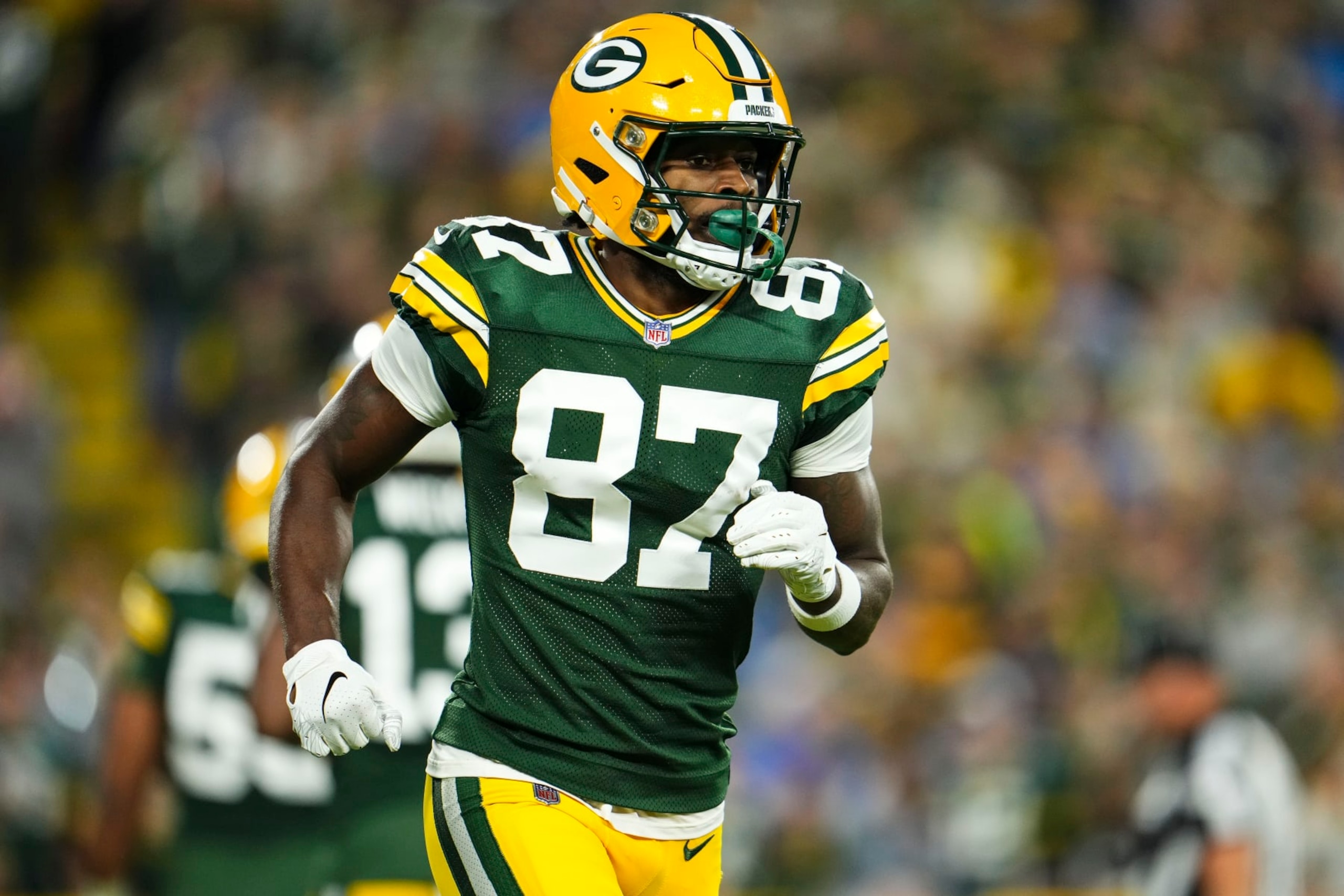 GREEN BAY, WI - SEPTEMBER 28: Romeo Doubs #87 of the Green Bay Packers runs off of the field during an NFL football game at Lambeau Field on September 28, 2023 in Green Bay, Wisconsin. (Photo by Cooper Neill/Getty Images)